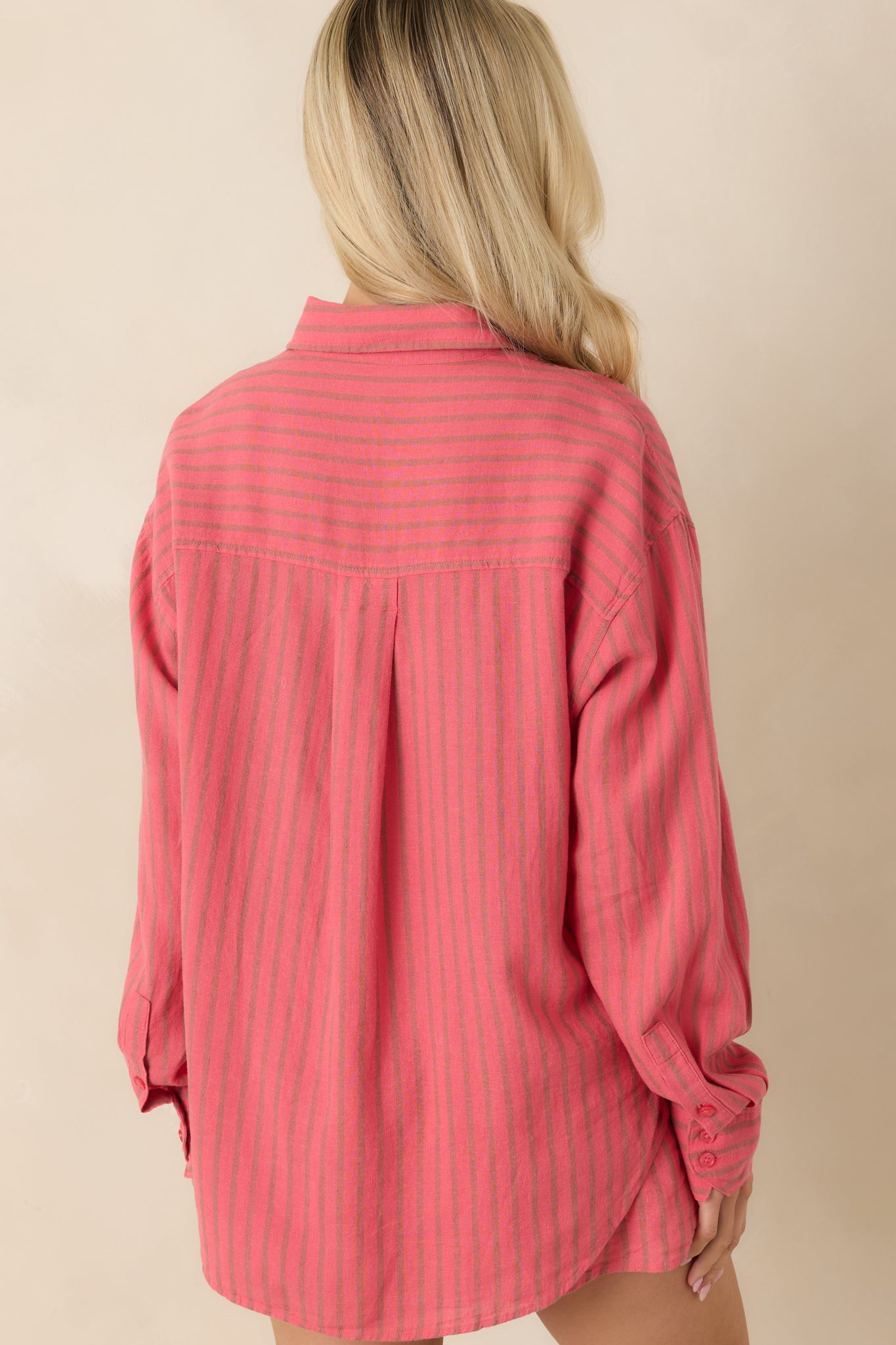 Rear view of indigo striped shirt featuring relaxed fit and clean back panel design.