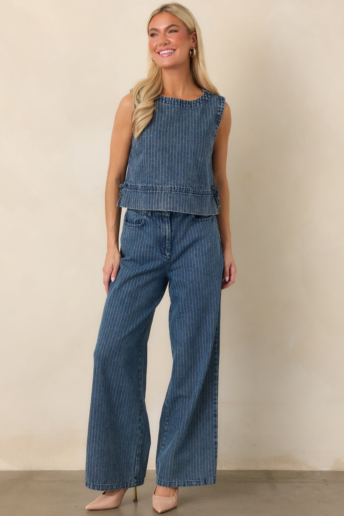 Soft cotton-blend denim pants with vertical indigo stripes, a flowing wide-leg shape, elastic waistband, and practical side pockets.