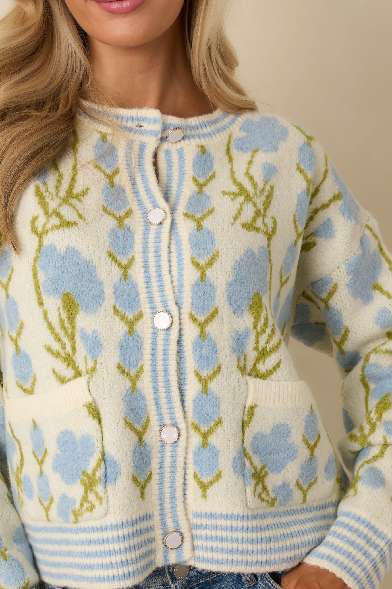 Detailed look at the ribbed trim, contrast striping, and soft knit floral fabrication.