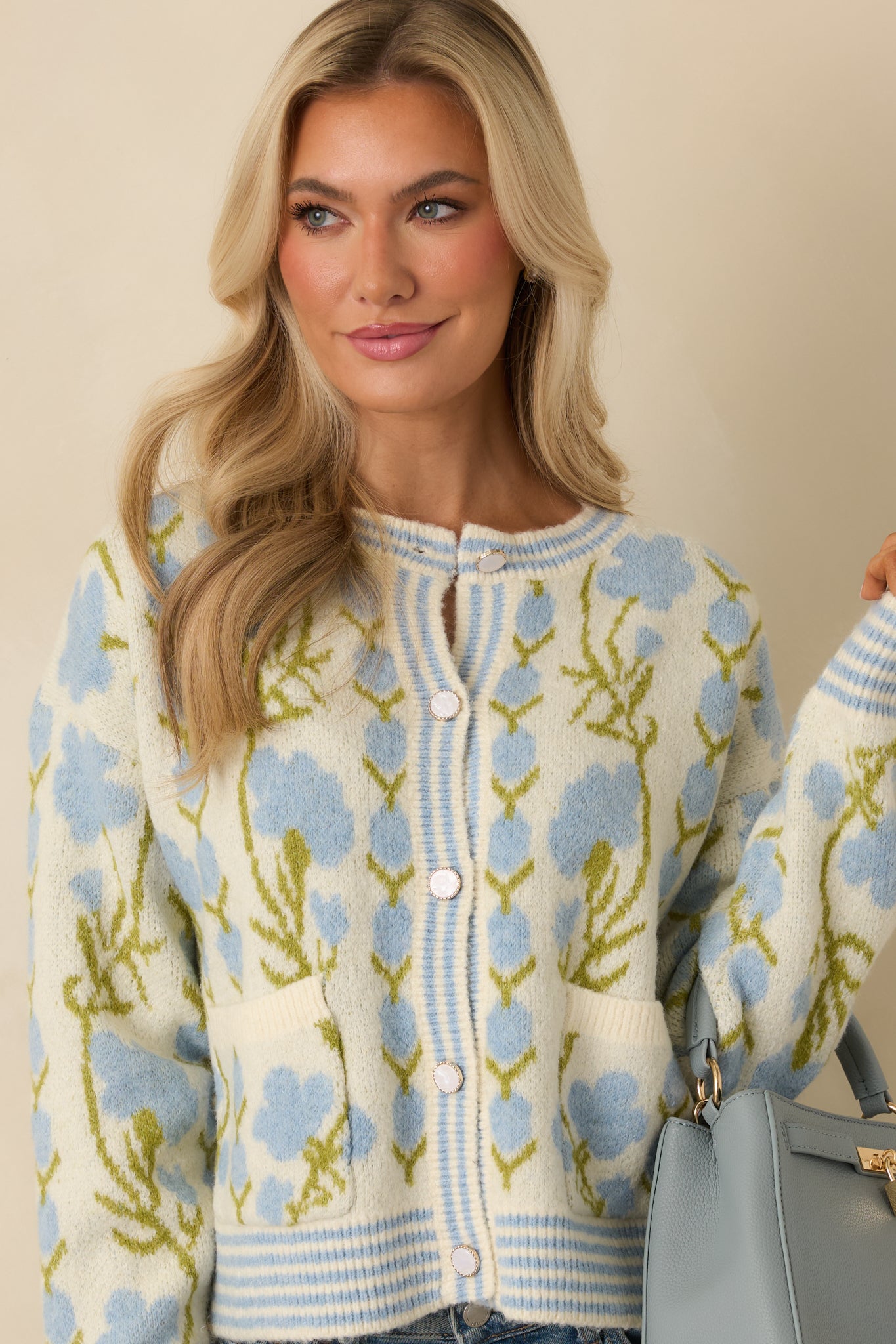 Closer view highlighting the round neckline, button-front closure, and ribbed trim.