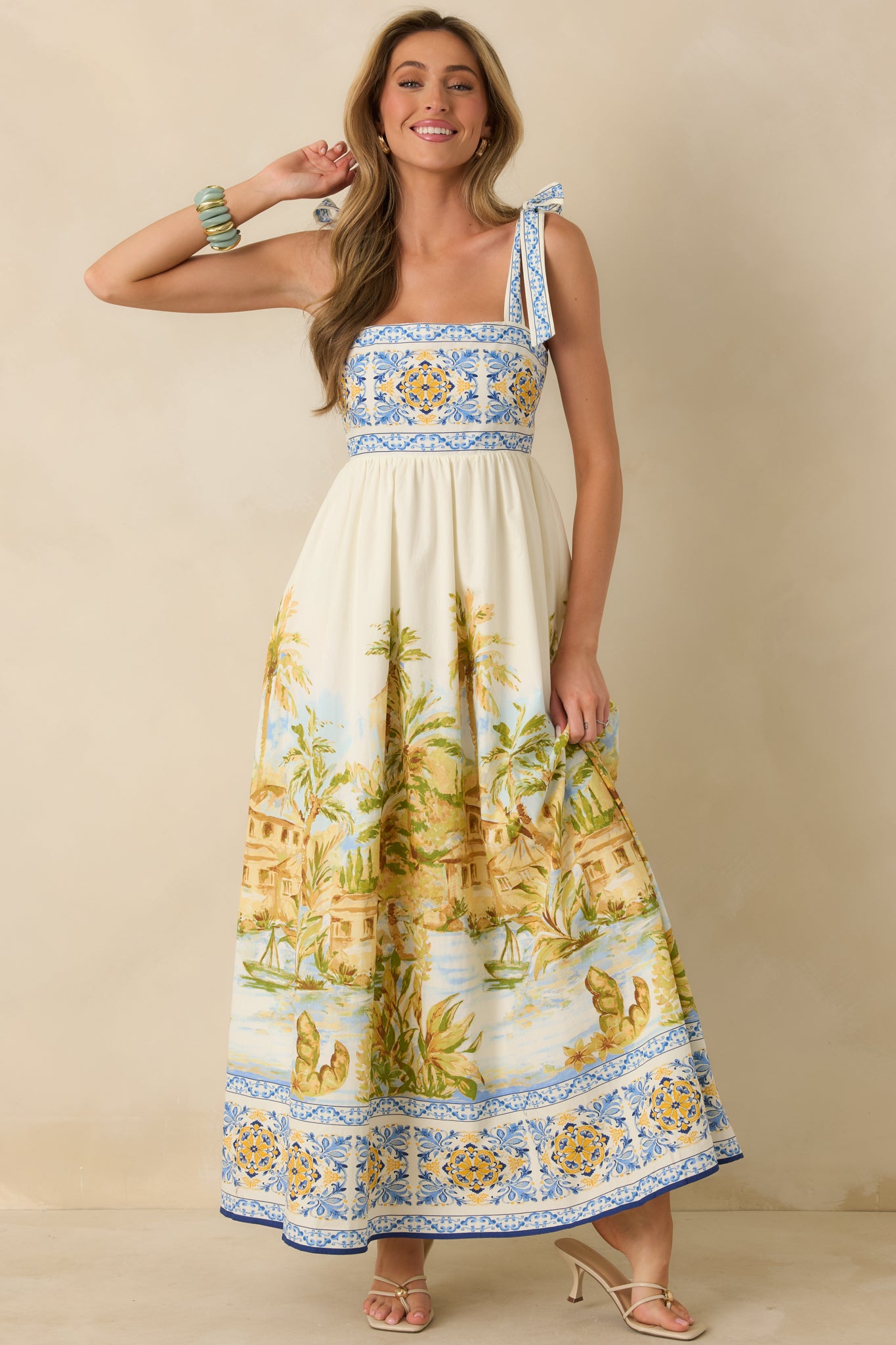 Ivory multi print maxi dress with flowing silhouette and contrast detailing at neckline and hem.