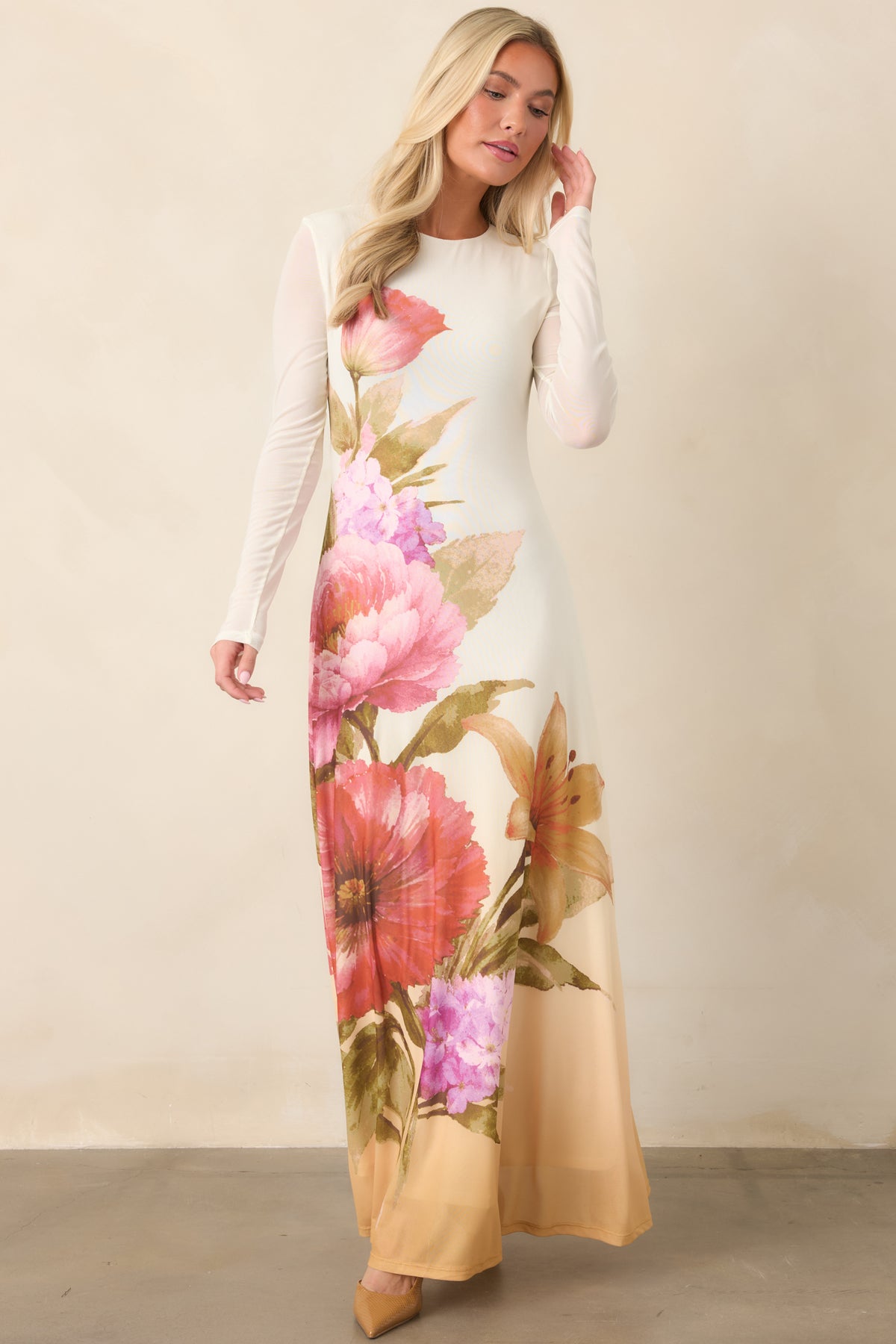 Fitted ivory dress with sheer sleeves and softly flared skirt.