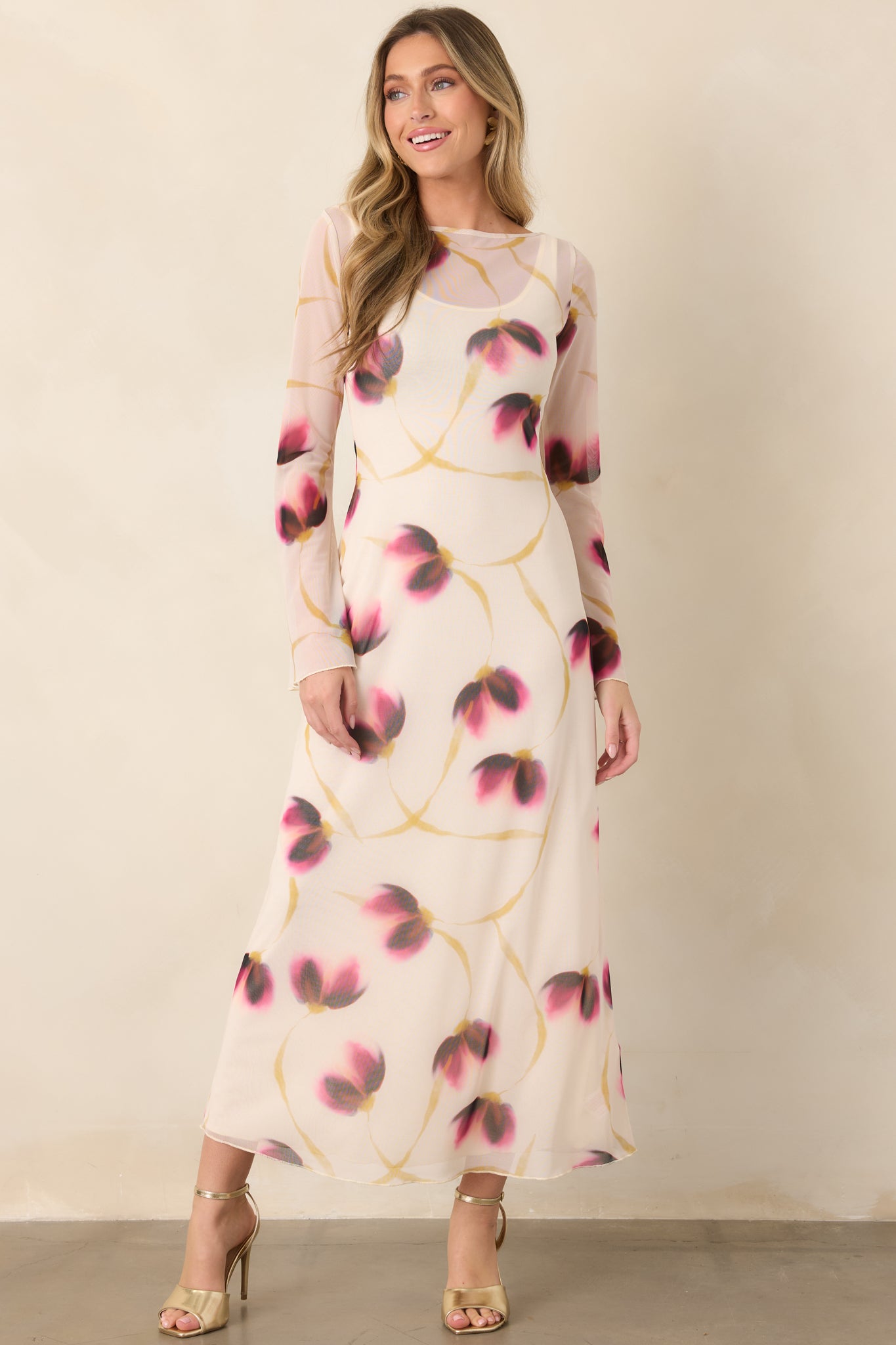 Full-length ivory floral mesh dress featuring a streamlined shape, subtle flared cuffs, and an elegant boat neckline.