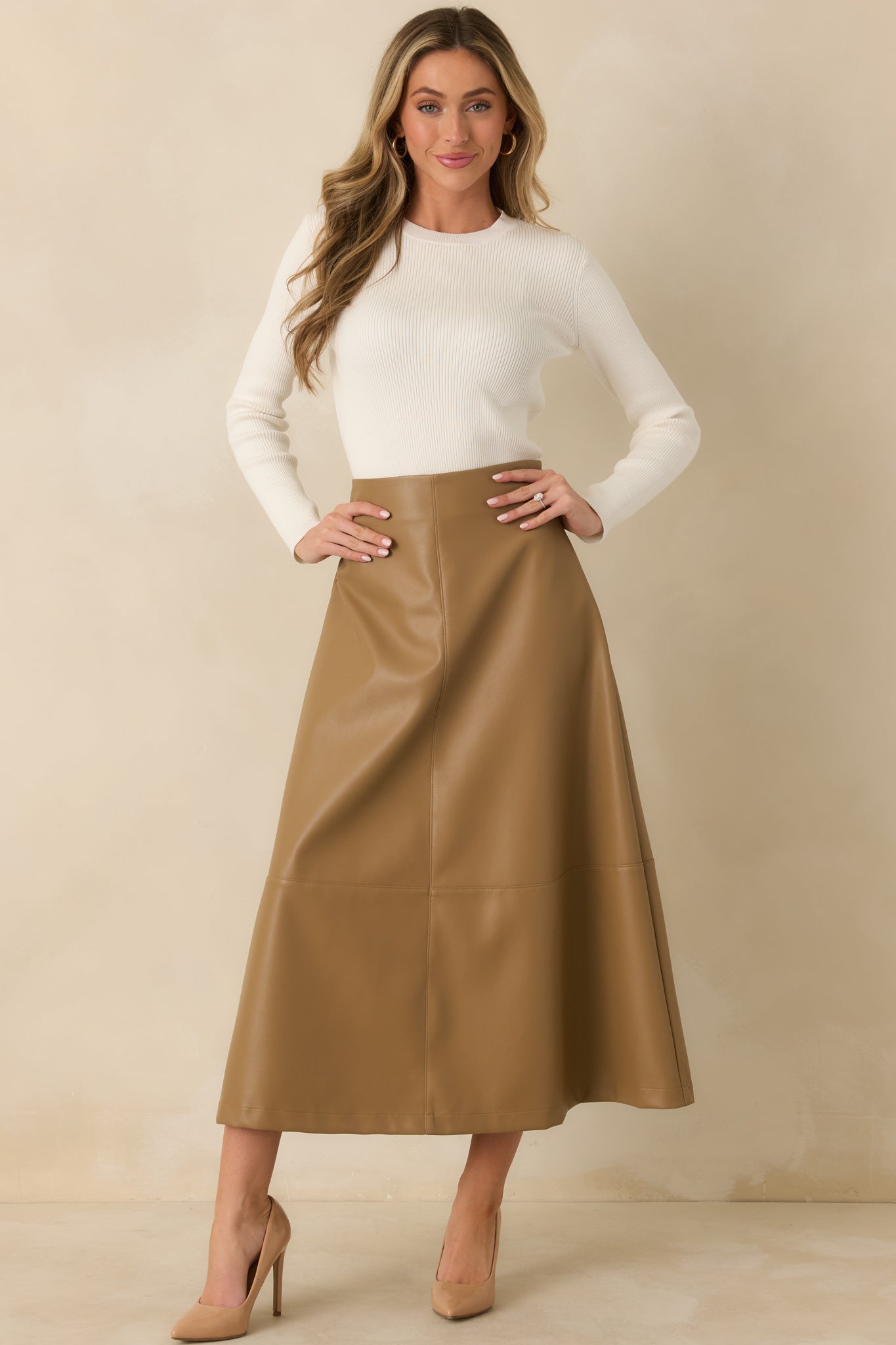 Ivory long sleeve knit top with a classic crew neckline, fitted silhouette, and fine ribbed texture.