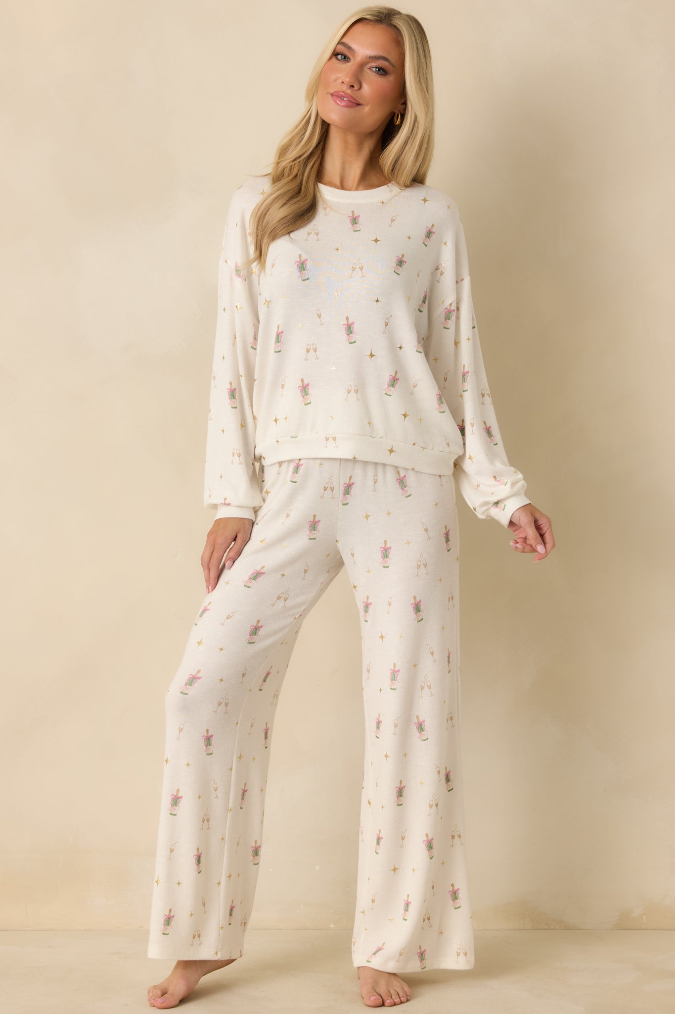 Ivory long sleeve top showing relaxed fit with wide crew neckline and dropped shoulders.