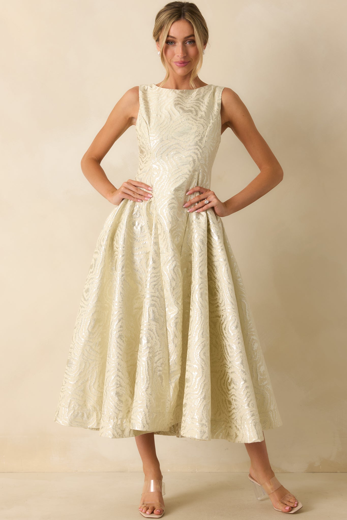 Ivory metallic jacquard dress displaying its tailored fit and luminous woven texture.
