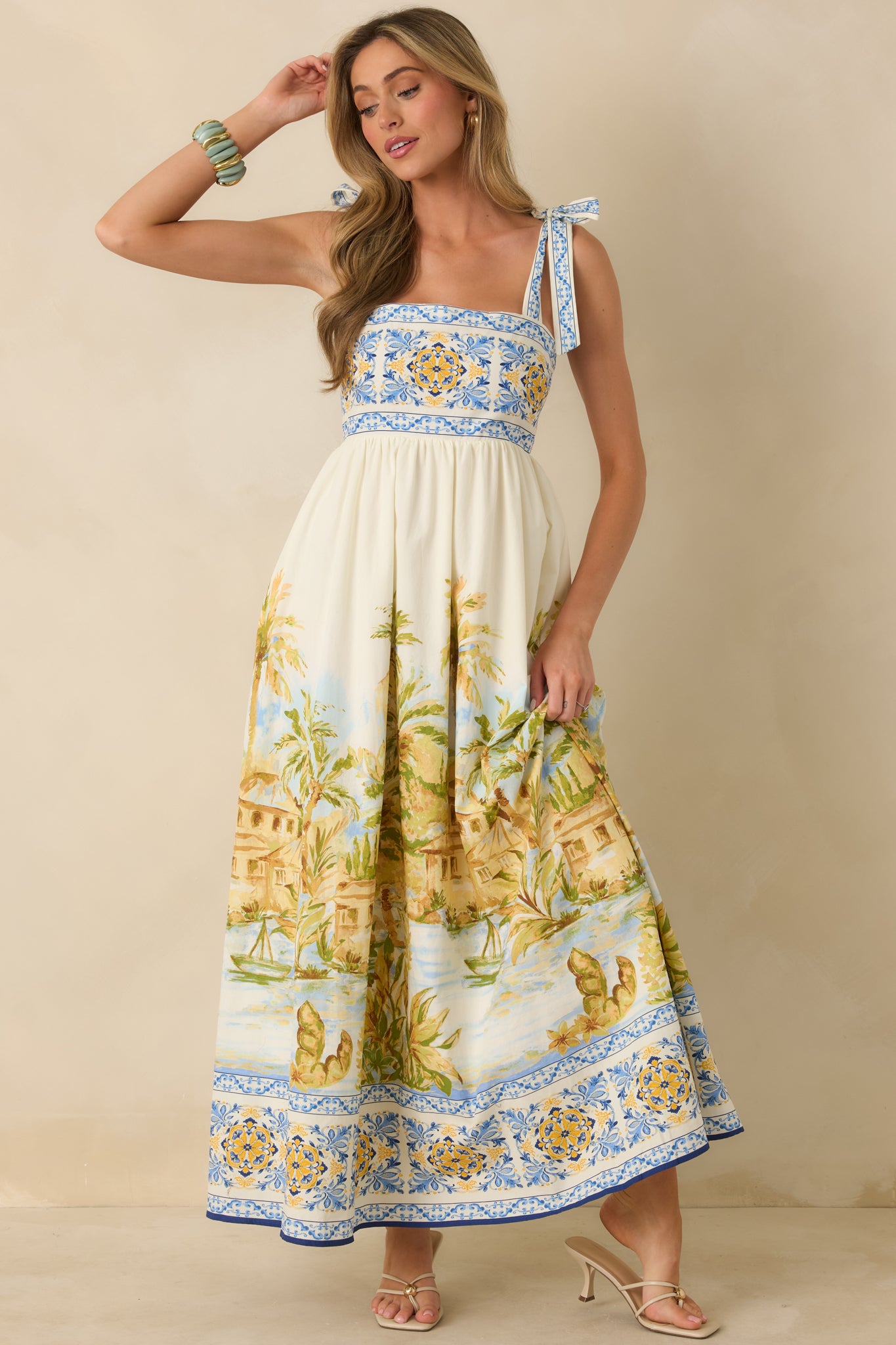 Ivory multi maxi dress with adjustable tie straps and softly structured bodice.