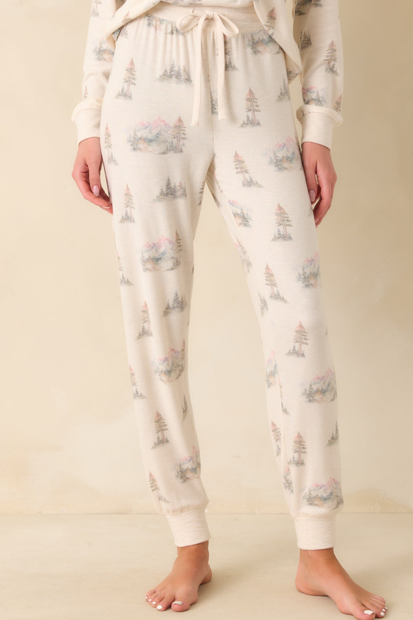 A cropped view focusing on the high rise elastic waistband and self-tie drawstring detail.