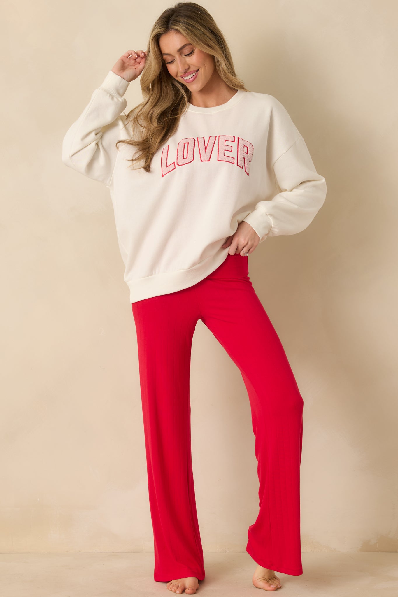 Ivory oversized sweatshirt highlighting the relaxed silhouette and classic crew neckline