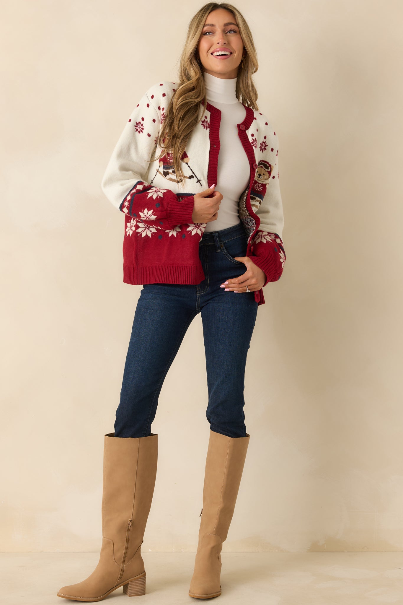 Ivory and red ski bear cardigan with a relaxed fit, ribbed trim, and playful intarsia snowflakes and Fair Isle details.