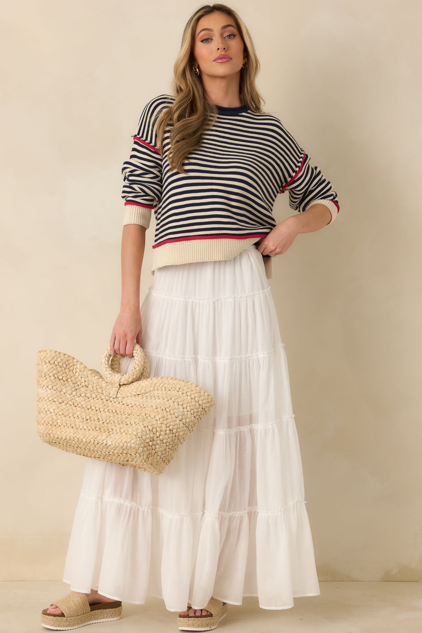 Full-length ivory skirt featuring softly gathered tiers, breathable lightweight fabric, and relaxed pull-on fit.