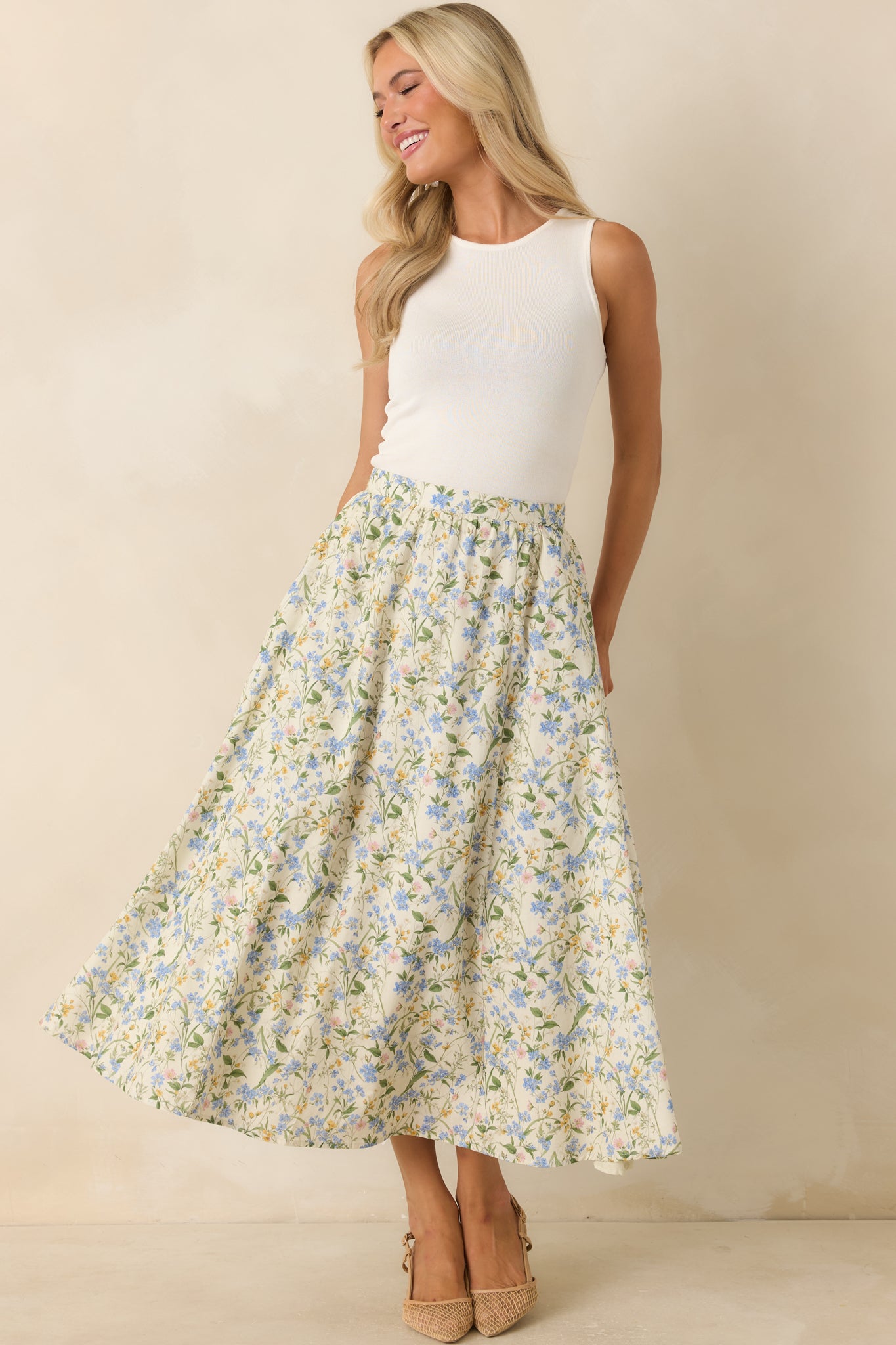 Sleeveless ivory tank featuring a comfortable stretch knit fabric and streamlined everyday design.