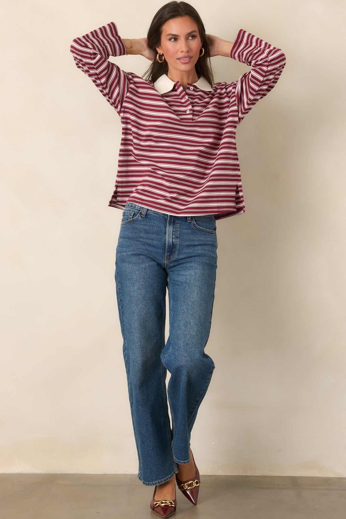 Ivory striped cotton top with a crisp contrasting collar, partial button-front placket, and casually relaxed shape.