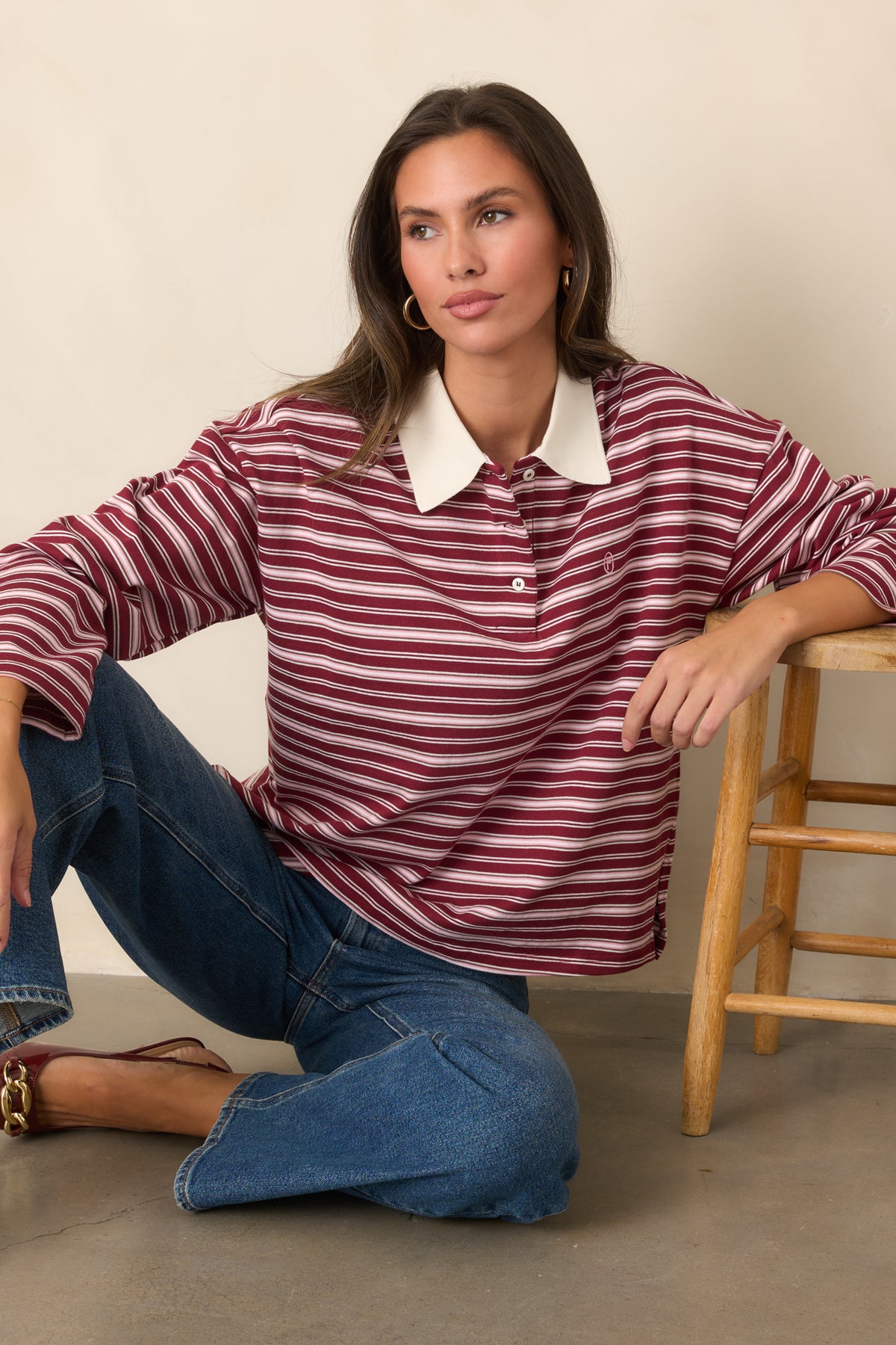 Ivory striped top showcasing the contrasting point collar, partial placket, and relaxed silhouette.