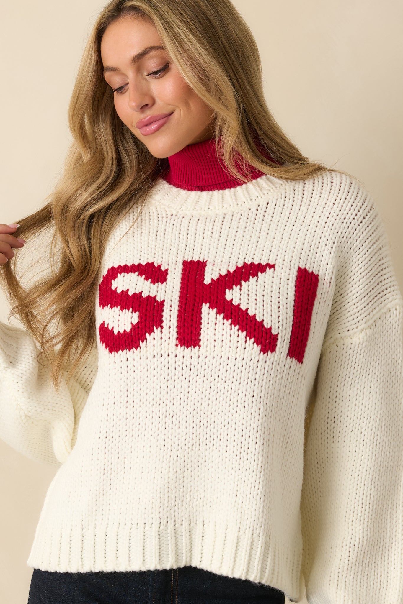 Front midsection crop showing the ribbed hem and lower portion of the “SKI” lettering.