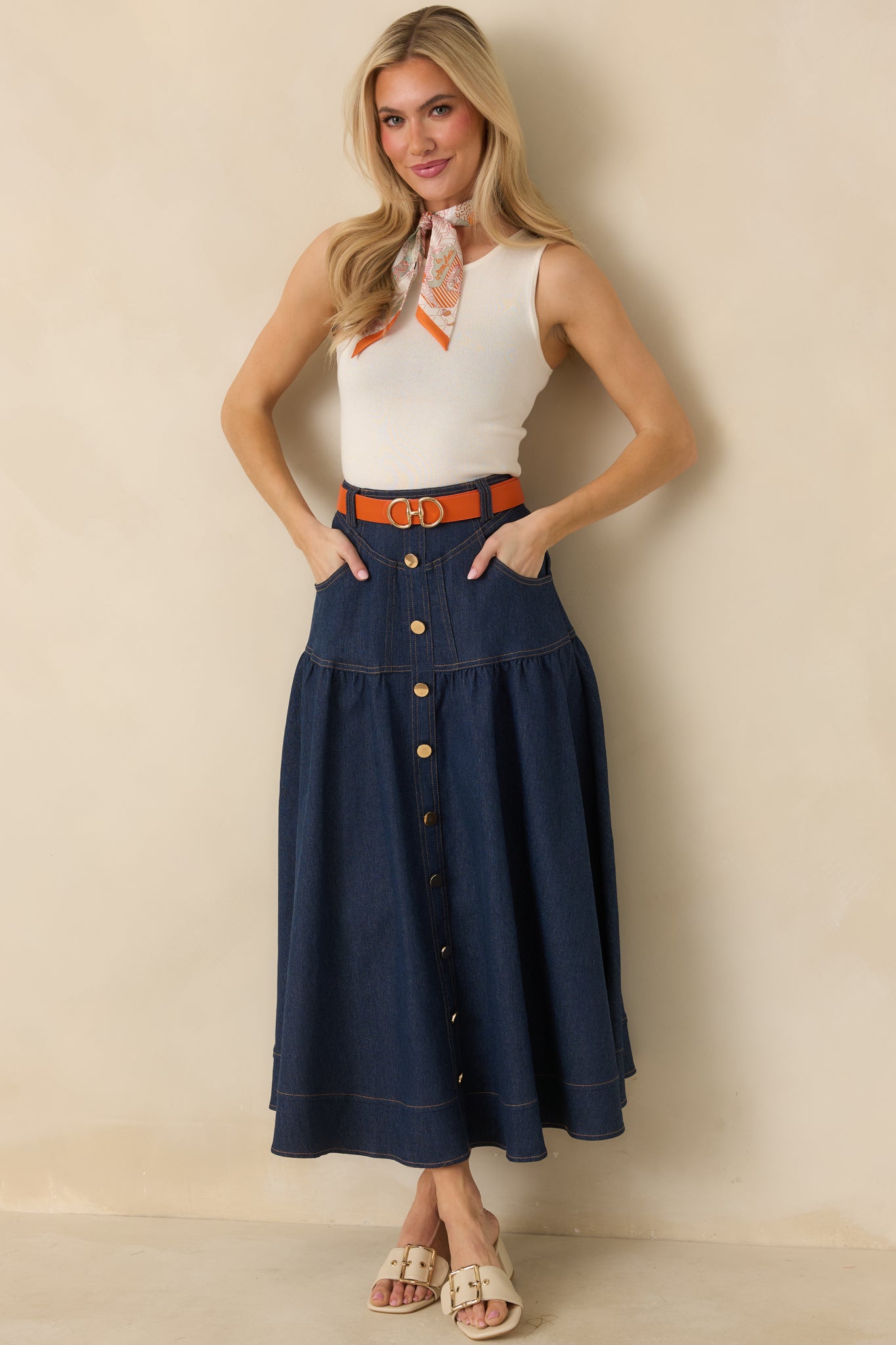 Front-facing full body image of the ivory tank showcasing the sleeveless cut and clean, streamlined shape.