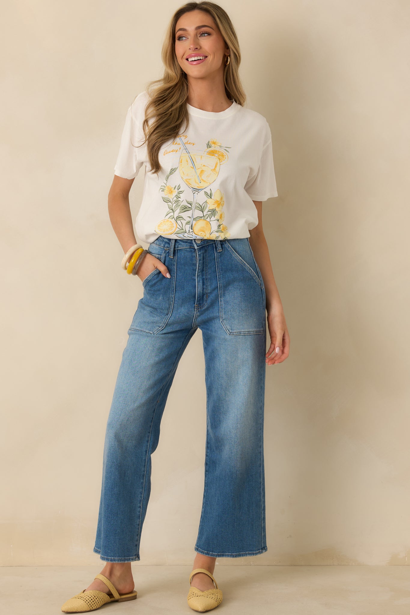 Ivory-toned white tee with front spritz cocktail graphic, short sleeves, and a comfortable boyfriend-style shape.