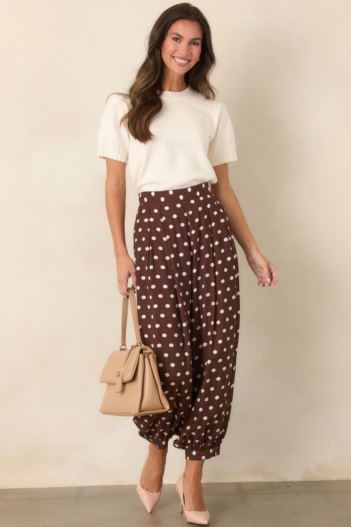 Creamy ivory wool-blend knit top with a classic crew neckline, short sleeves, and relaxed fit.