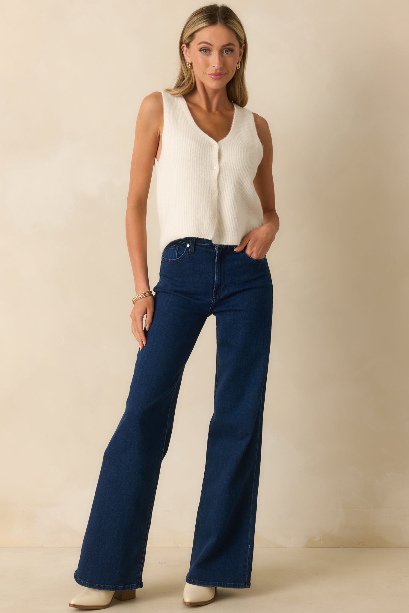 Jeans featuring functional front and back pockets and relaxed wide-leg silhouette.