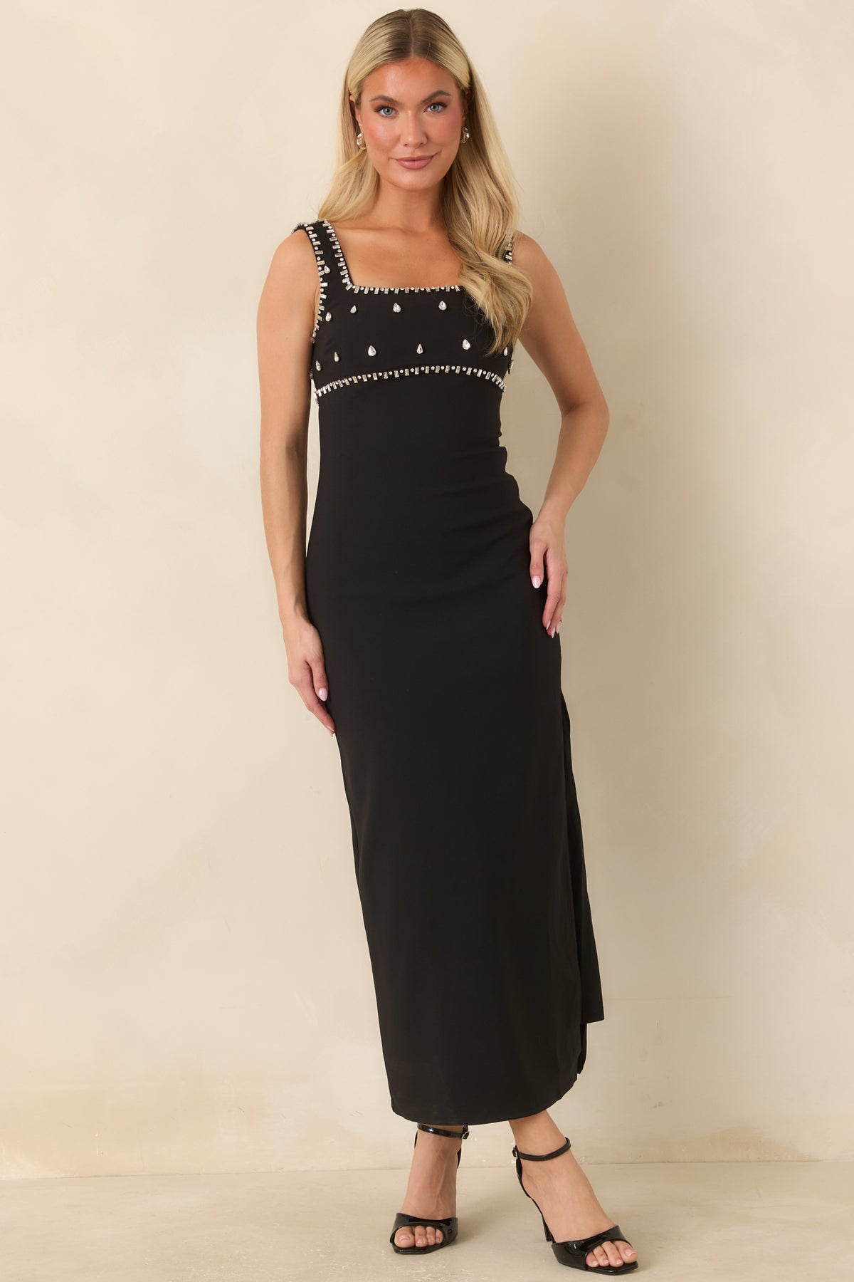 Sleek sleeveless midi dress with a jeweled square neckline, fitted silhouette, and side slit.