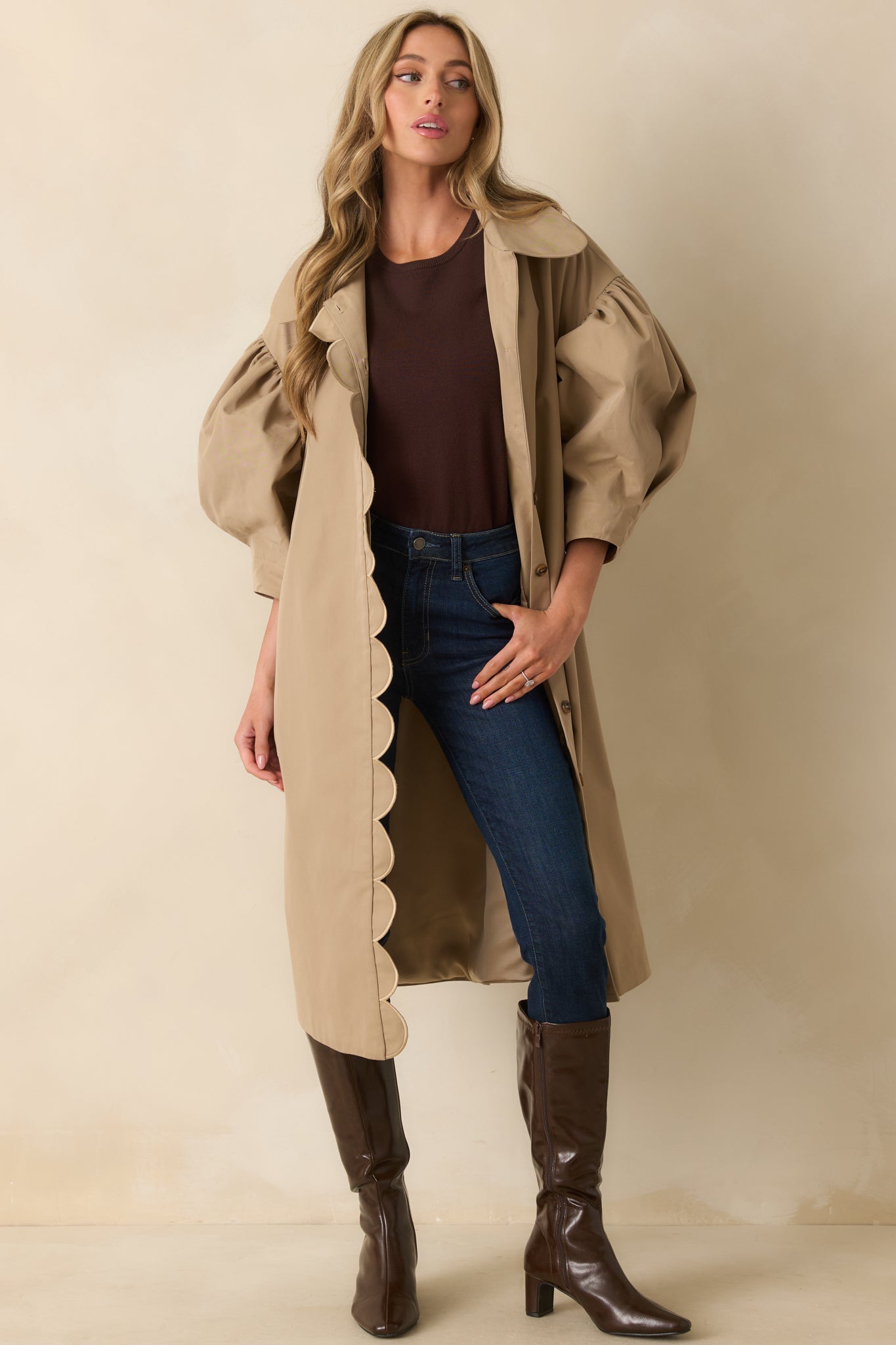 Puff sleeve khaki coat with gathered shoulders and functional button front closure.