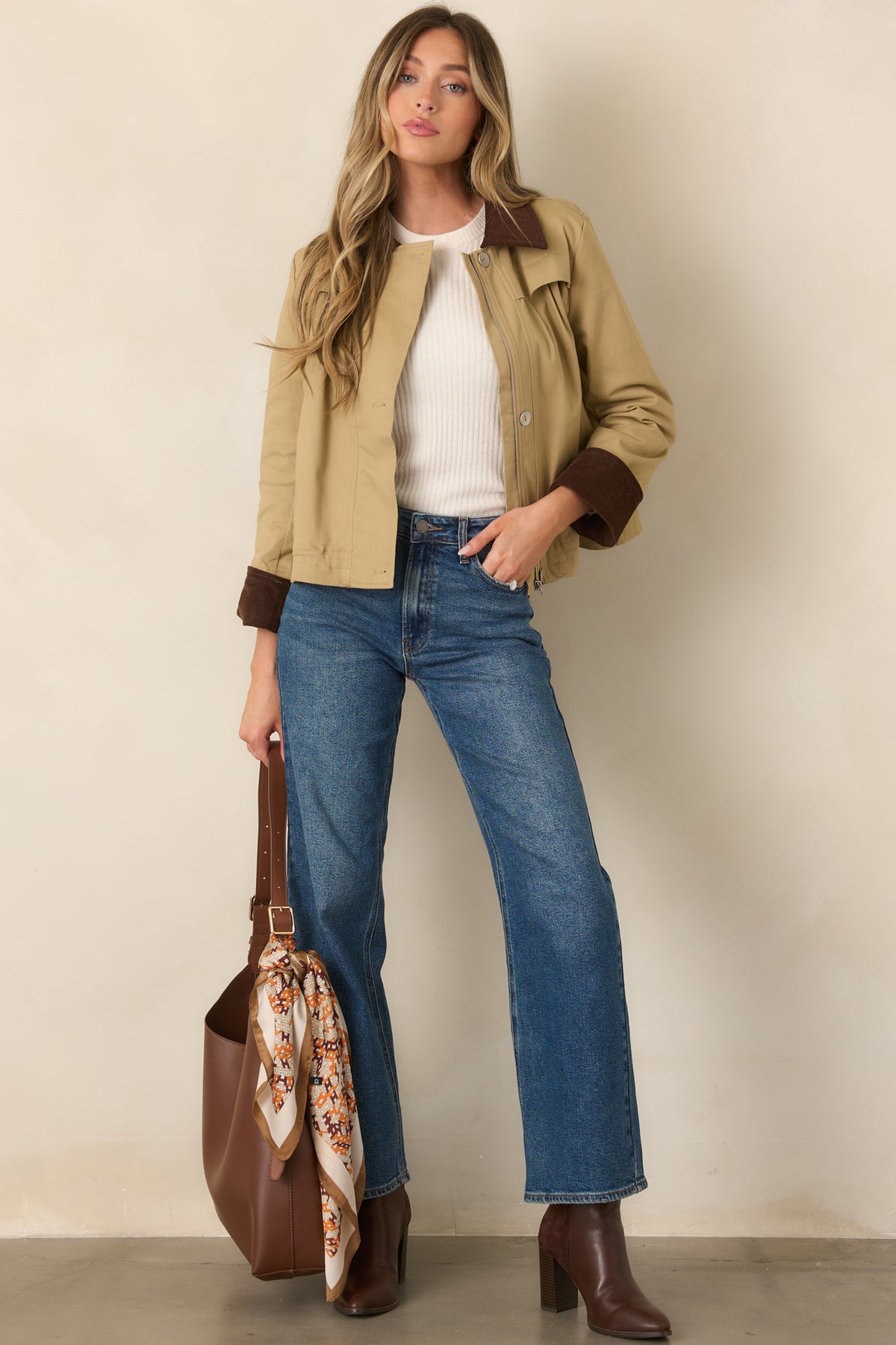 Structured khaki jacket with a rich brown corduroy collar, slightly cropped silhouette, and functional side pockets.
