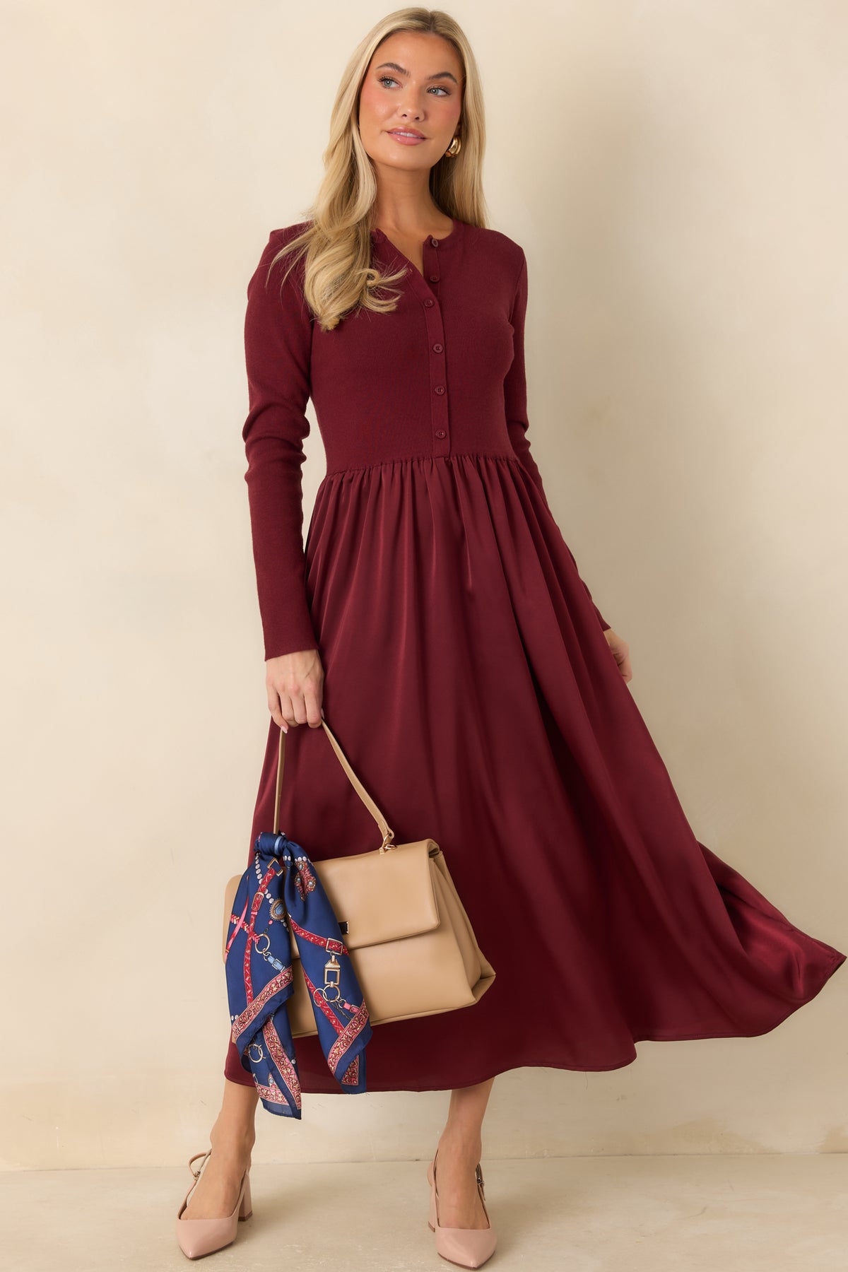 Midi dress with a cardigan-style knit bodice, tonal buttons, and a gathered satin skirt.