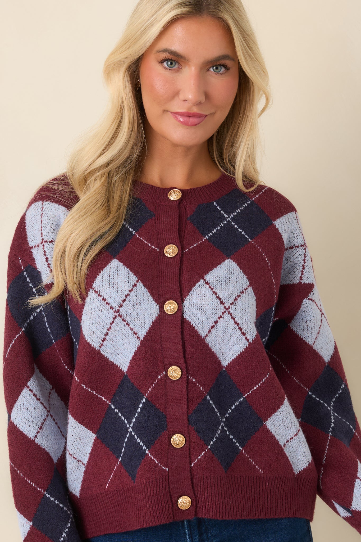 Navy and light blue diamonds create a classic contrast on this button-front knit cardigan.