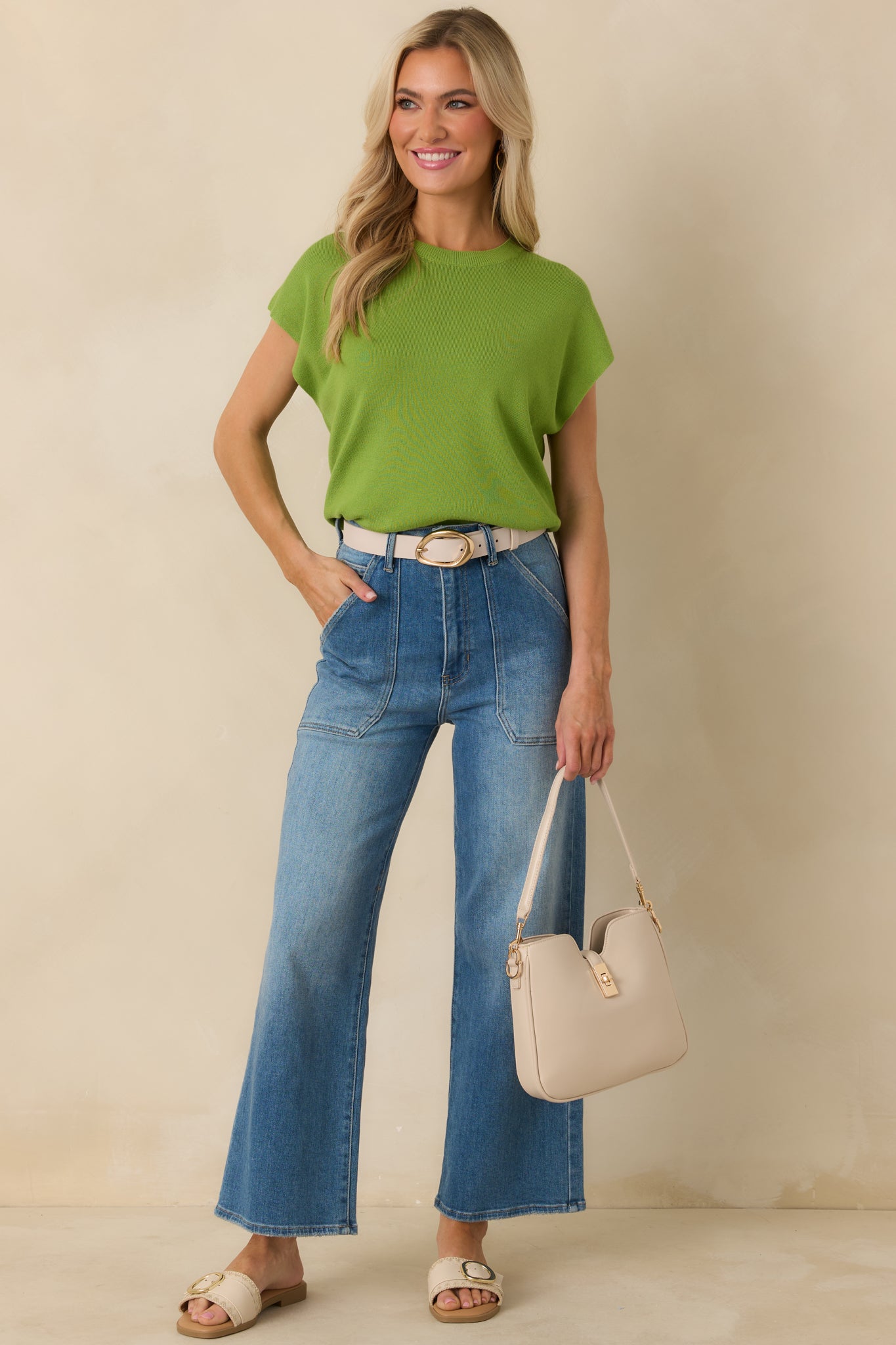 Lightweight knit crewneck sweater with short relaxed sleeves and straight silhouette.