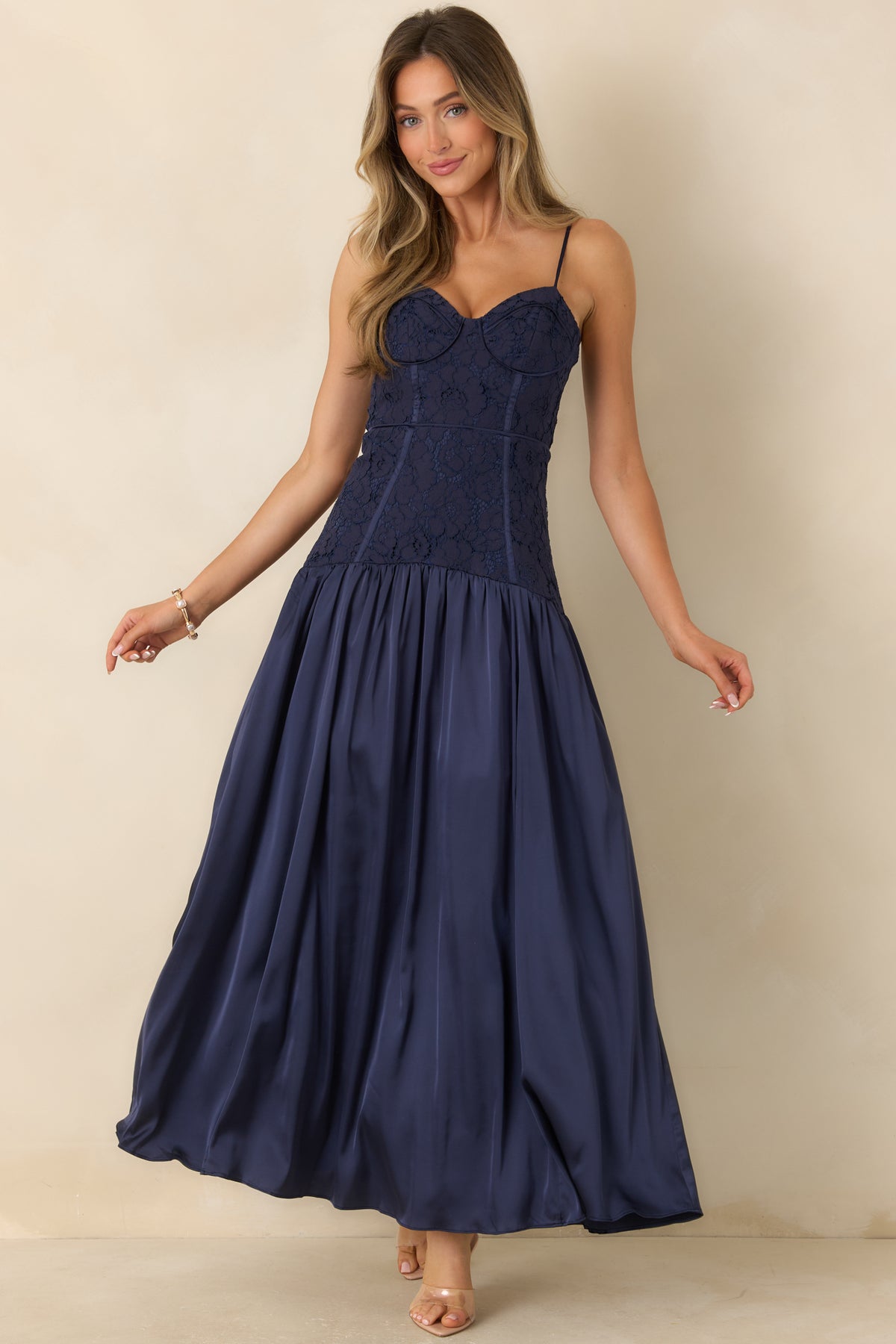 Full-length satin dress with a lace bustier, defined bodice seams, and a gathered skirt with added fullness.