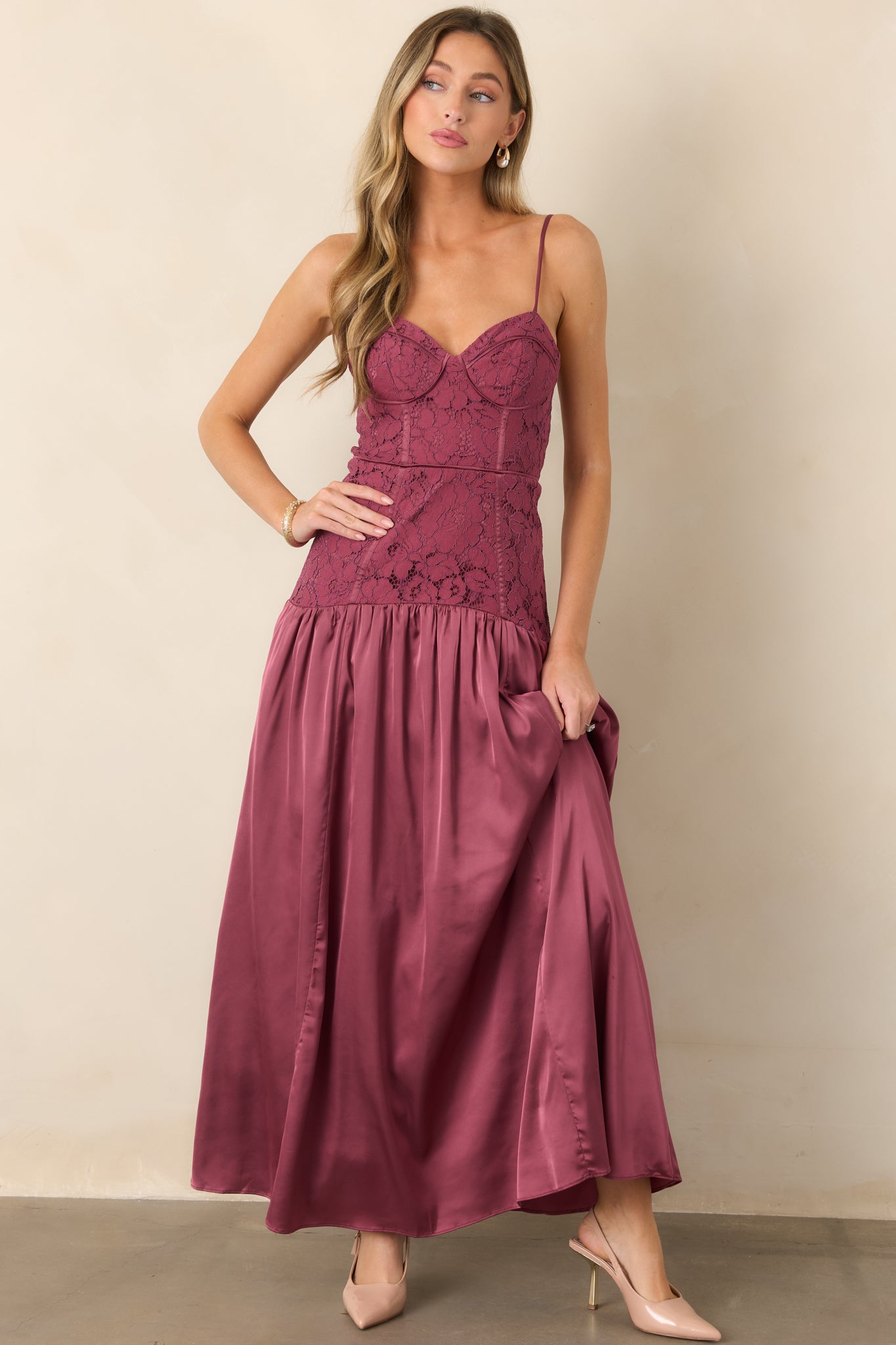 Lace and satin maxi dress showcasing the sweetheart neckline, delicate straps, fitted bodice, dropped waist, and softly gathered skirt with graceful fullness.