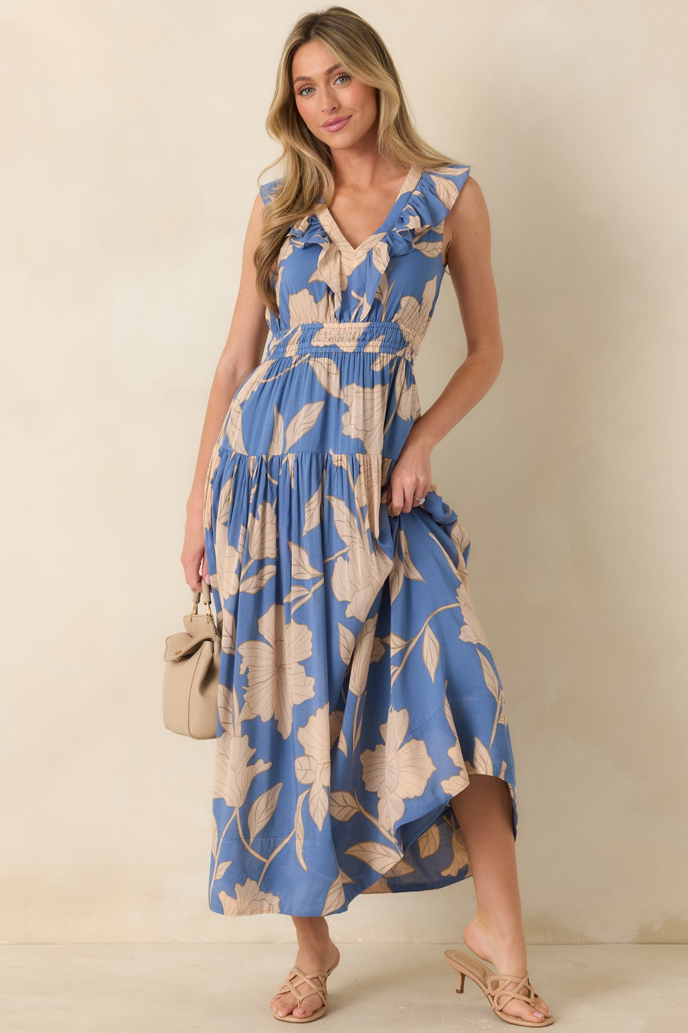 Lake blue maxi dress featuring ruffle detailing at the neckline, a breezy fit, and an elegant tiered silhouette.