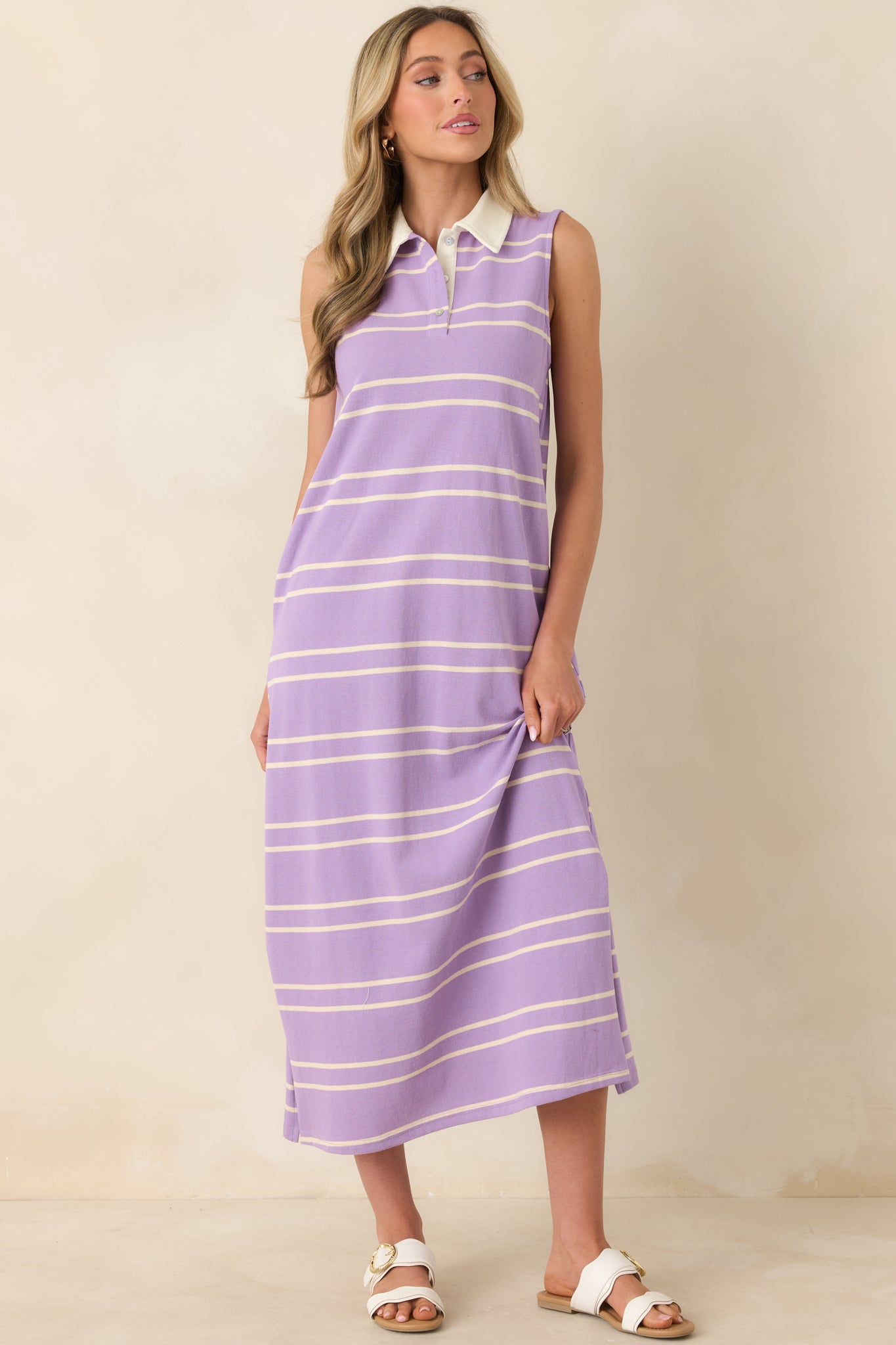 Lavender and neutral striped silhouette designed with a structured collar and polished partial placket.