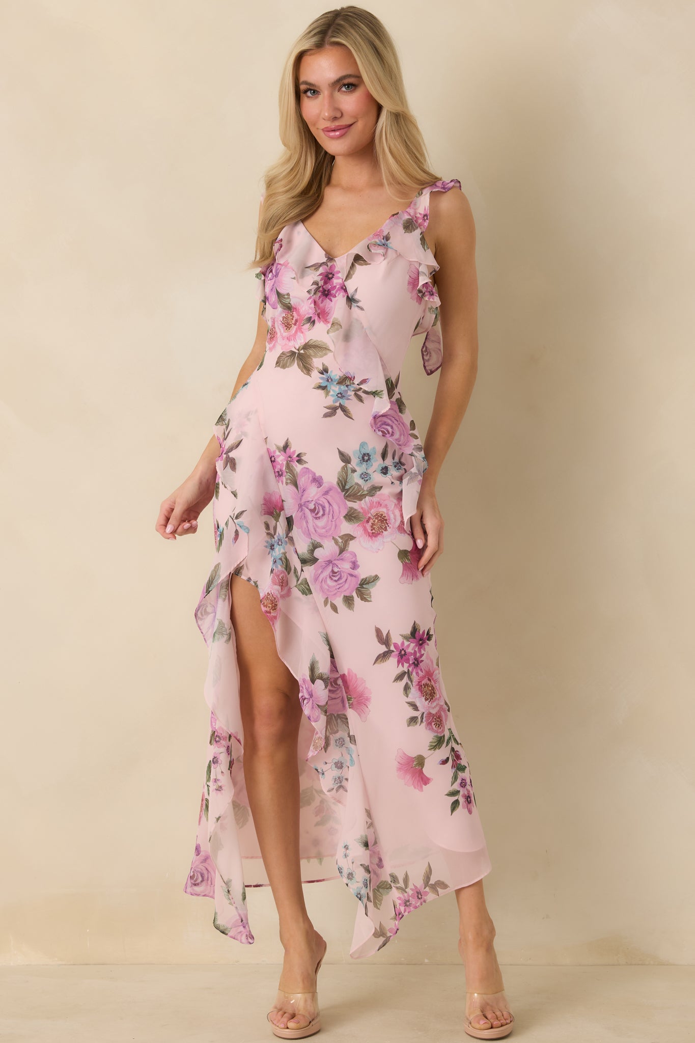 Lavender multi chiffon maxi dress with an allover floral print, V neckline, and ruffled sleeveless straps.