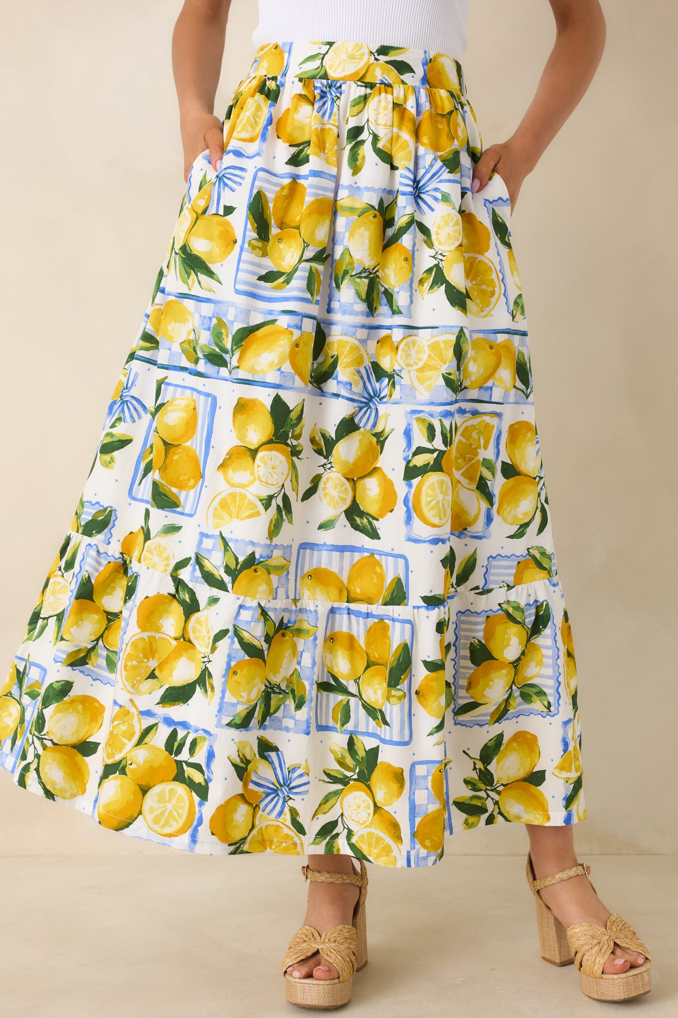 Side pocket detail hidden within the lemon print midi skirt, blending seamlessly into the flowy cotton design.