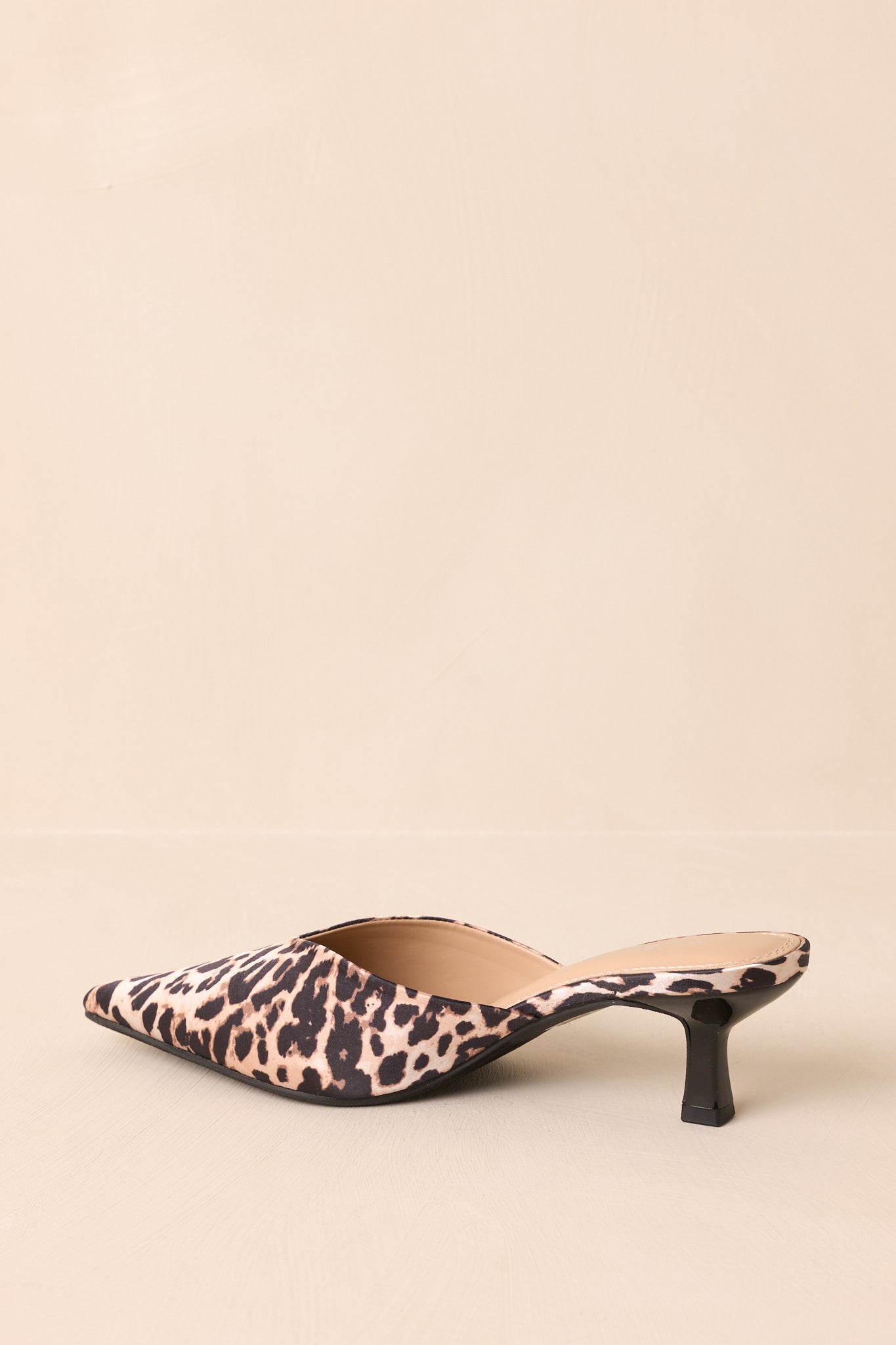 Leopard heels viewed from low angle showing heel height and shape.