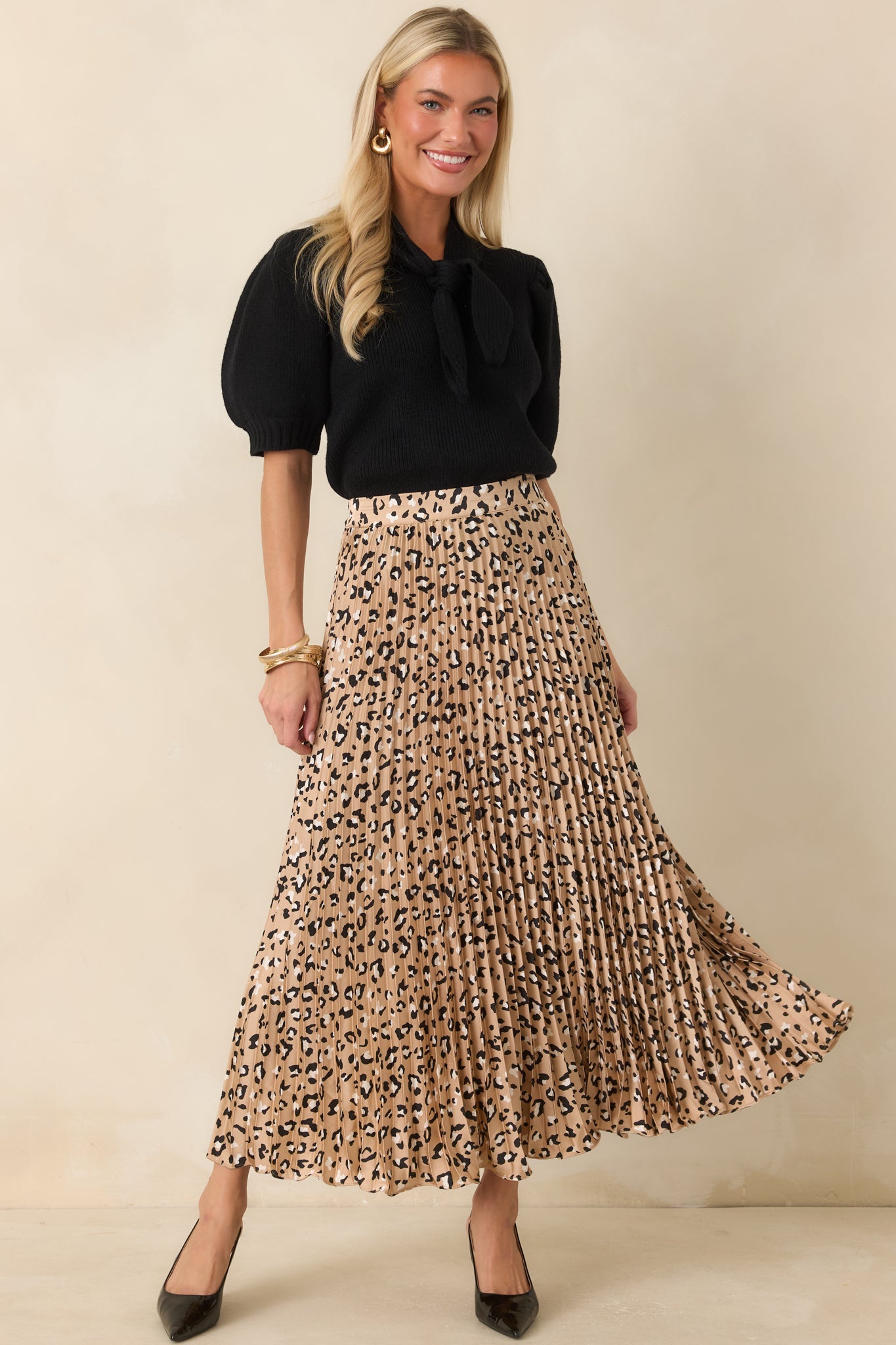 Leopard print maxi skirt featuring a silky satin finish, elegant pleats, and a flowing silhouette with effortless movement.