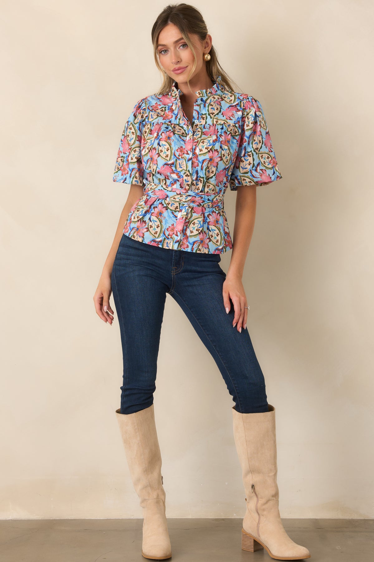 Light blue floral blouse with pink blooms, winding green vines, a ruffled stand collar, and removable waist belt.