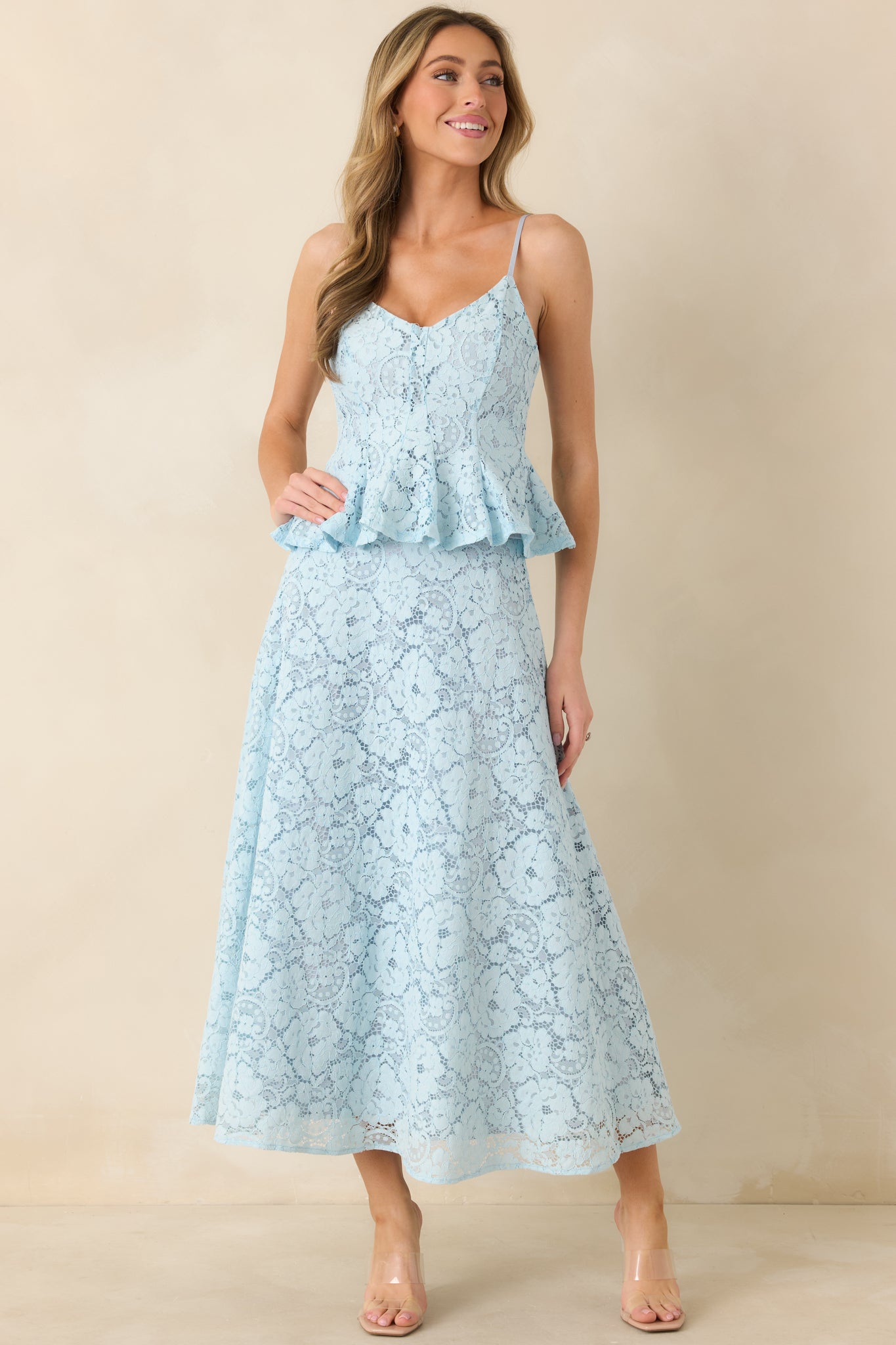 Light blue high-waist skirt with flared hem and detailed guipure lace overlay.