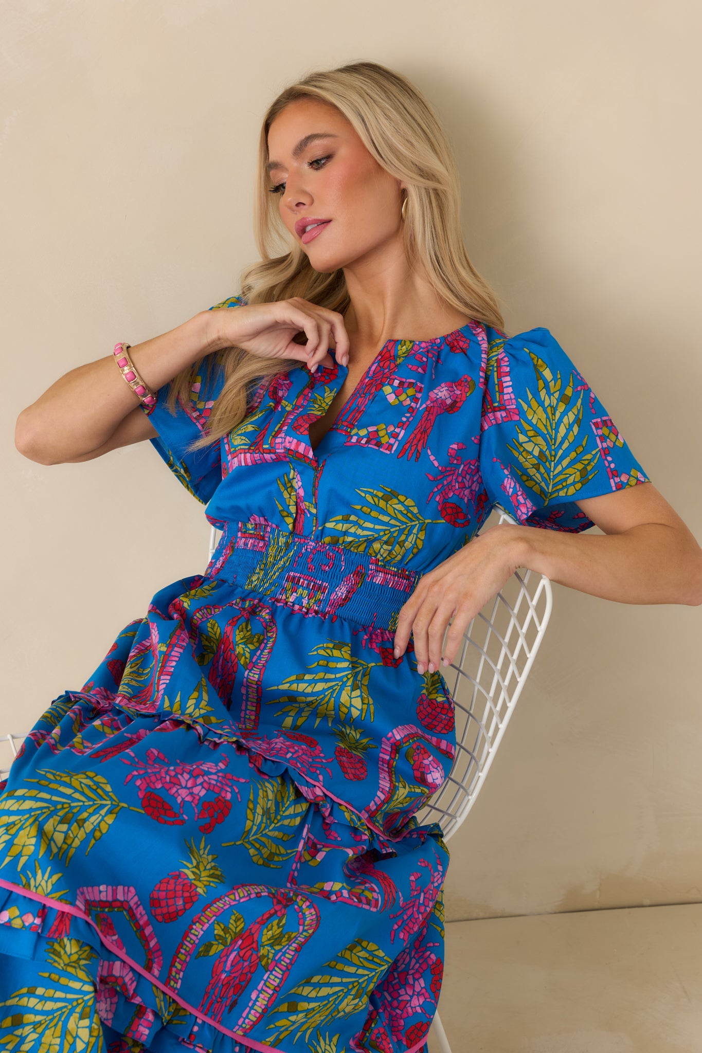 Lightweight cotton maxi dress with a smocked waistband and flowing tiered skirt with contrast trim.