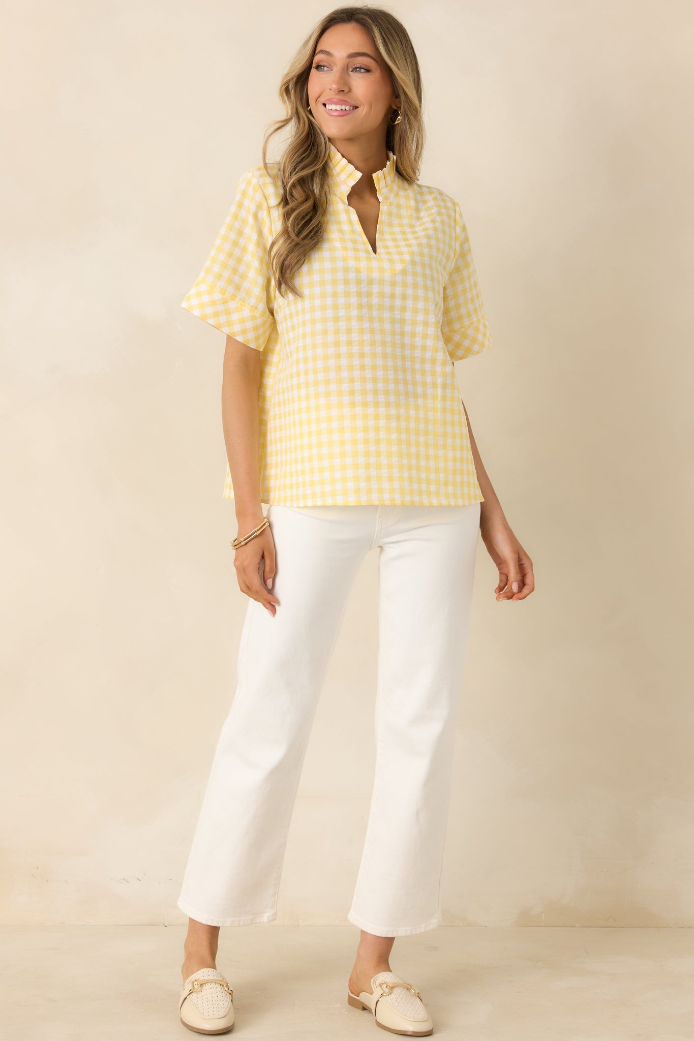 Lightweight cotton top featuring relaxed fit, short sleeves, and casual drape.