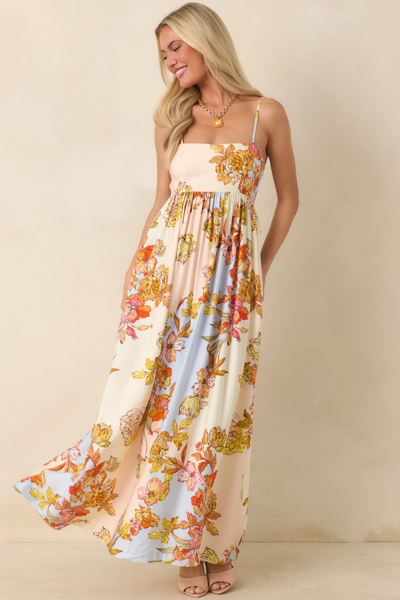 Lightweight floral maxi dress with a romantic pastel print, gathered bodice, and elegant full-length design.