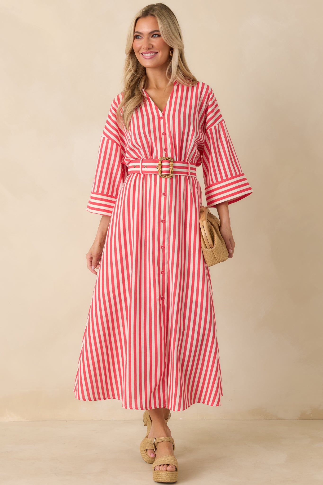 Lightweight red striped shirt dress showcasing elbow-length sleeves, classic collar, and easy maxi-length drape