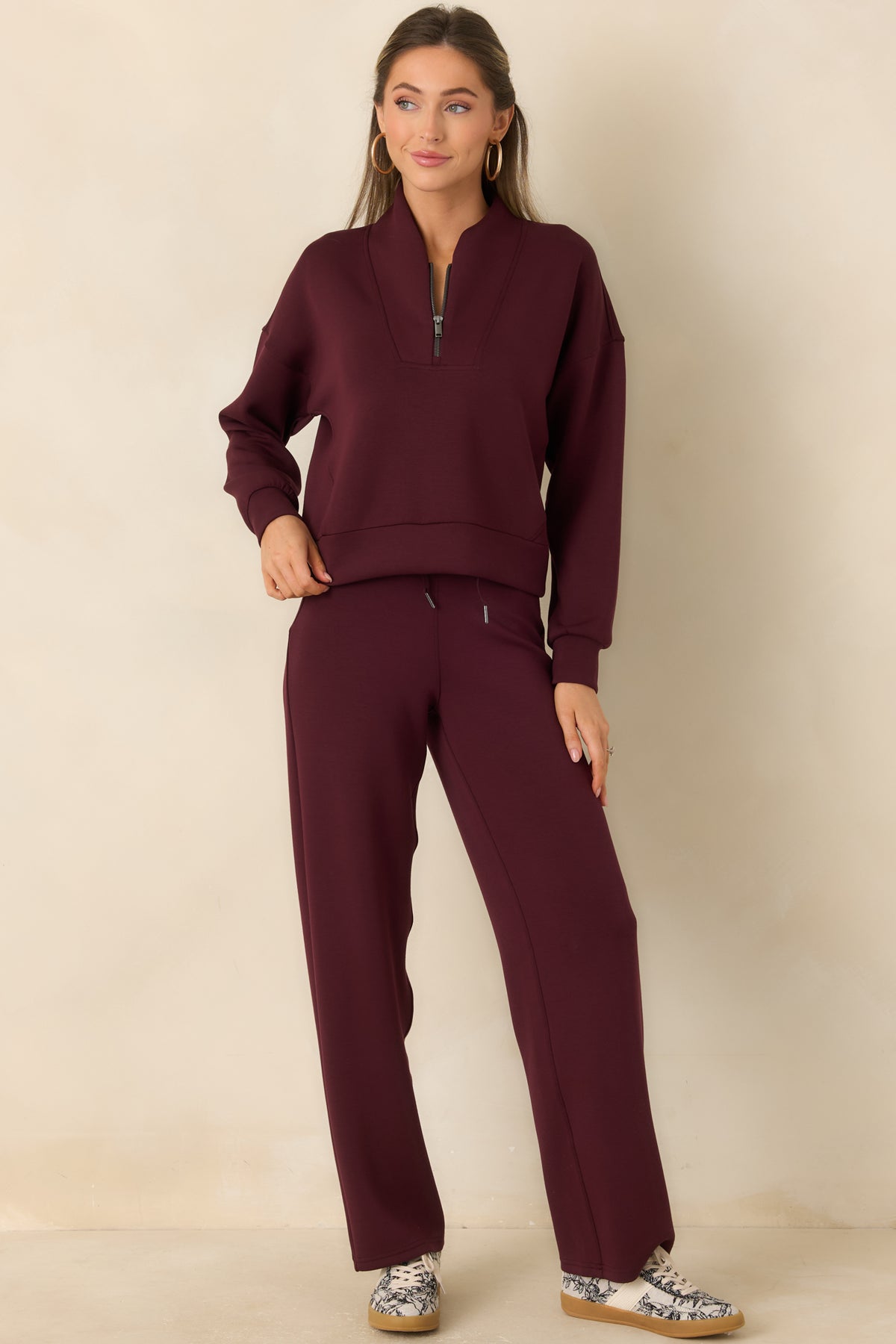 Lightweight pullover featuring a wide shawl collar and long sleeves.