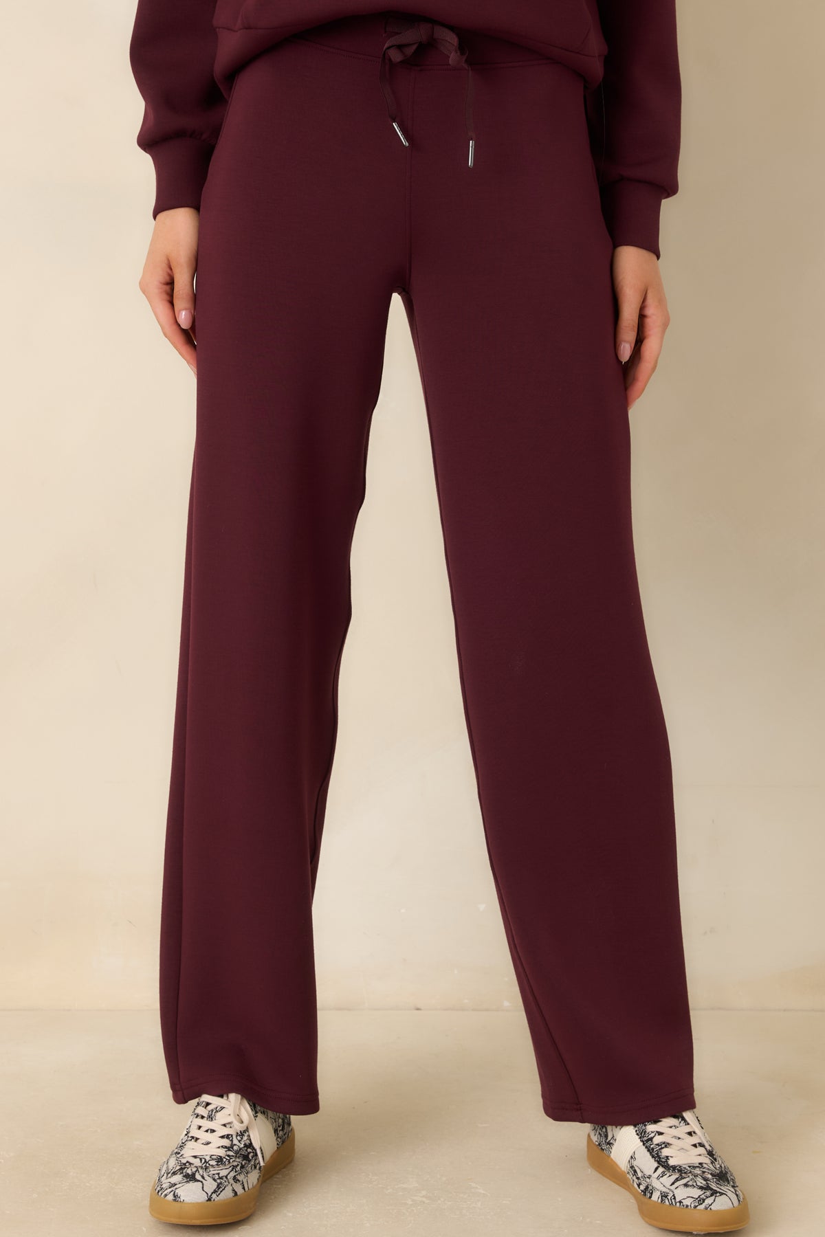 Lightweight spacer fabric pants with a smooth surface and softly draped legs.