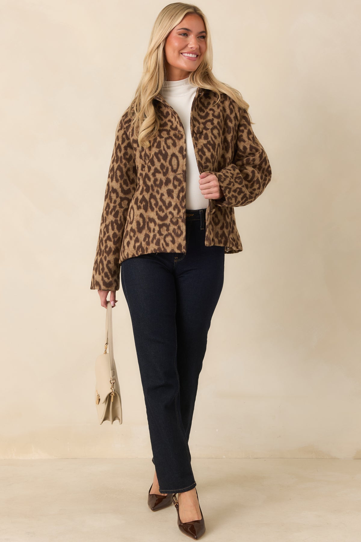 Fully lined camel leopard jacket with a spread collar, roomy sleeves, and practical side pockets.