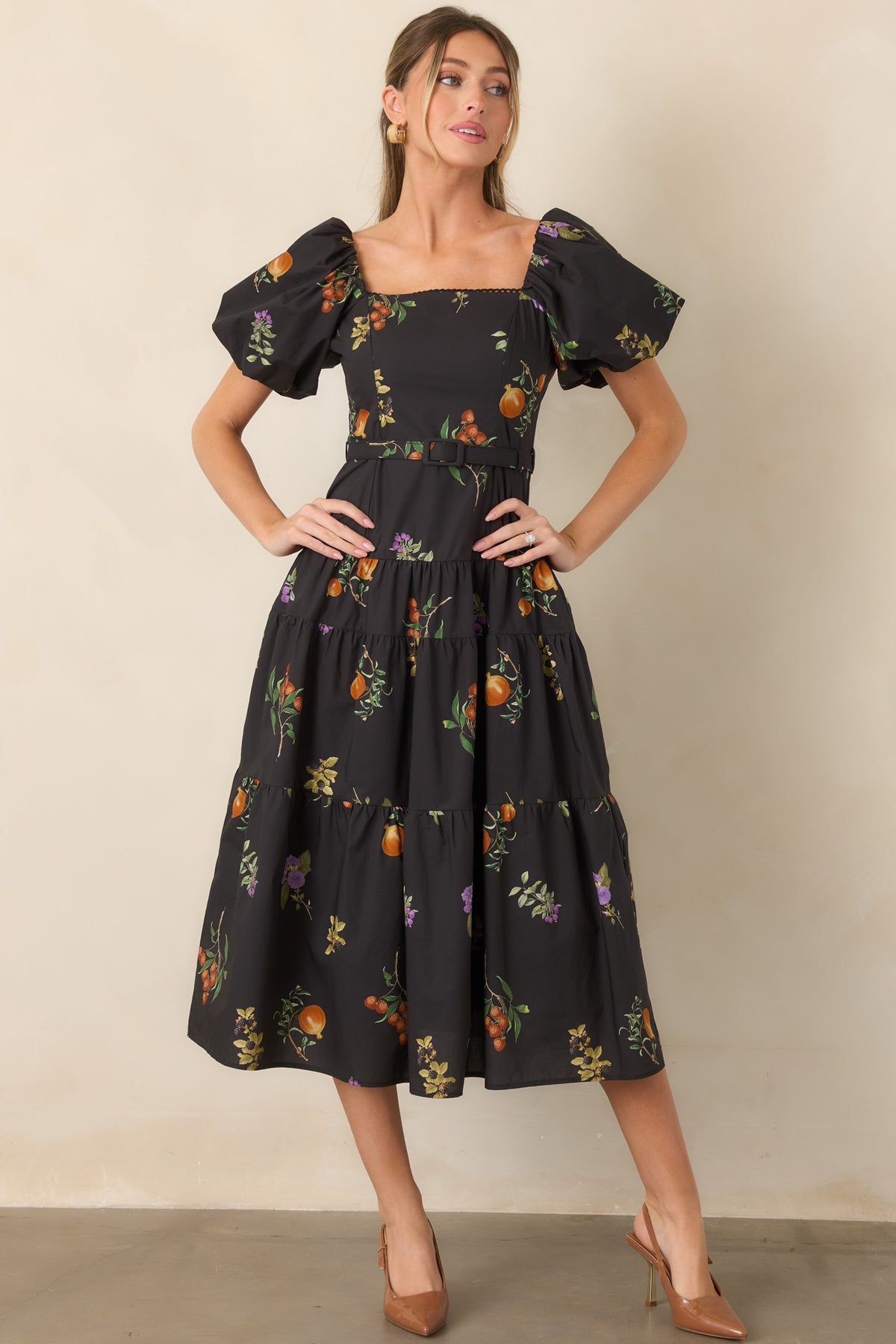 Lined cotton dress featuring a fitted bodice, delicate neckline trim, statement puff sleeves, and a defined waist with belt.