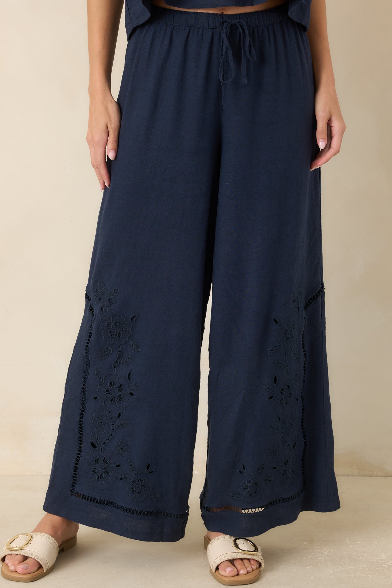 The front of these linen blend pants highlights the comfortable drawstring waistband and flowing shape.