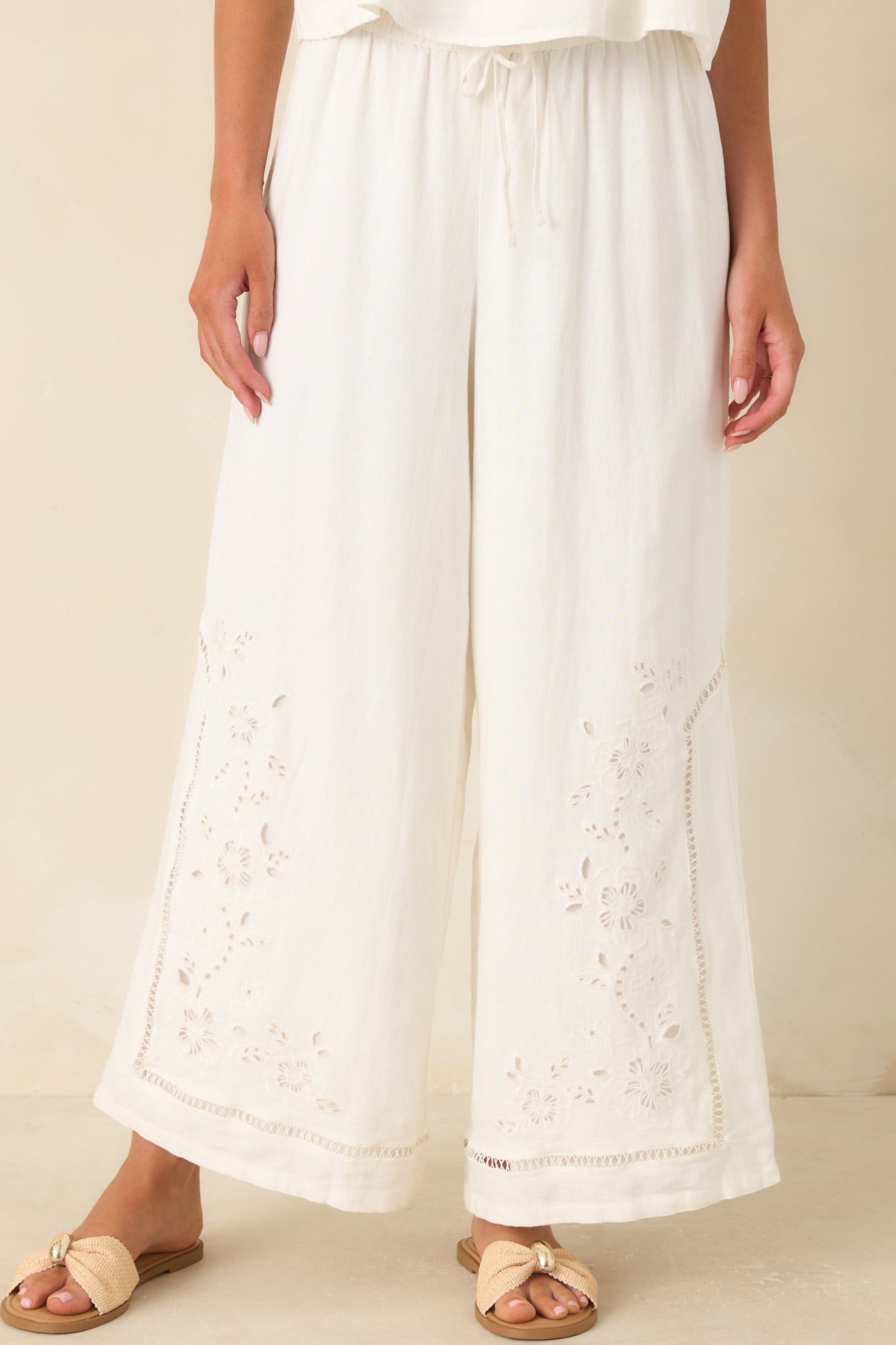 The front of these linen blend pants highlights the drawstring waistband and wide leg design.