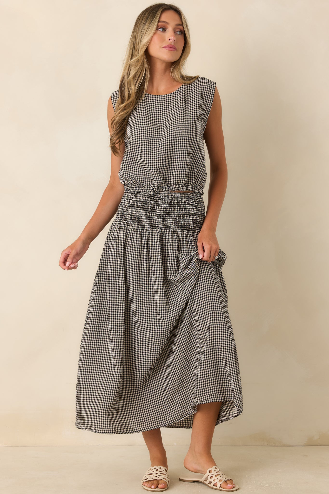 Flowing linen rayon blend maxi skirt featuring a wide smocked waistband and soft natural drape.